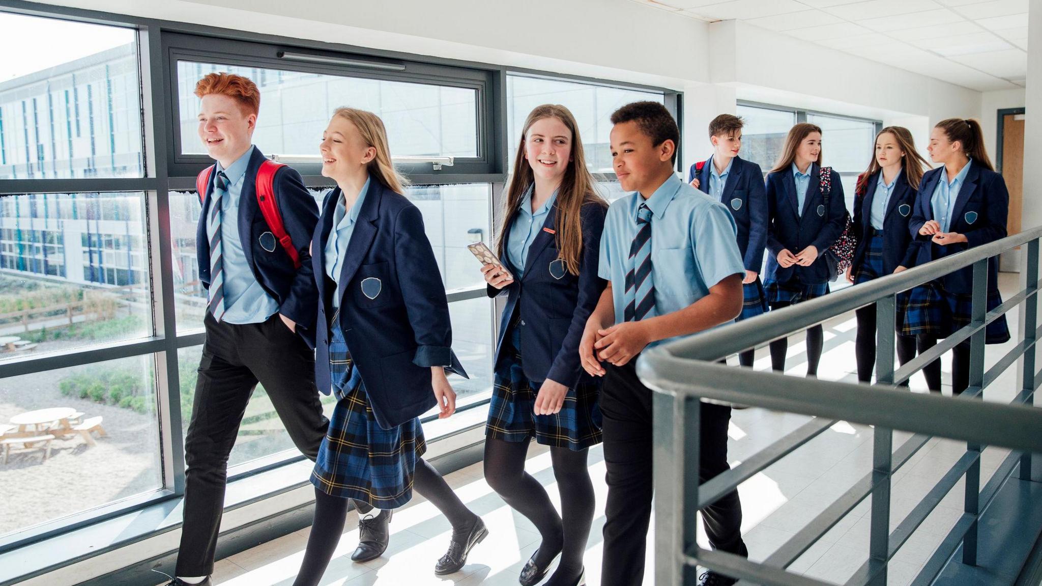 Teenagers walking to class 