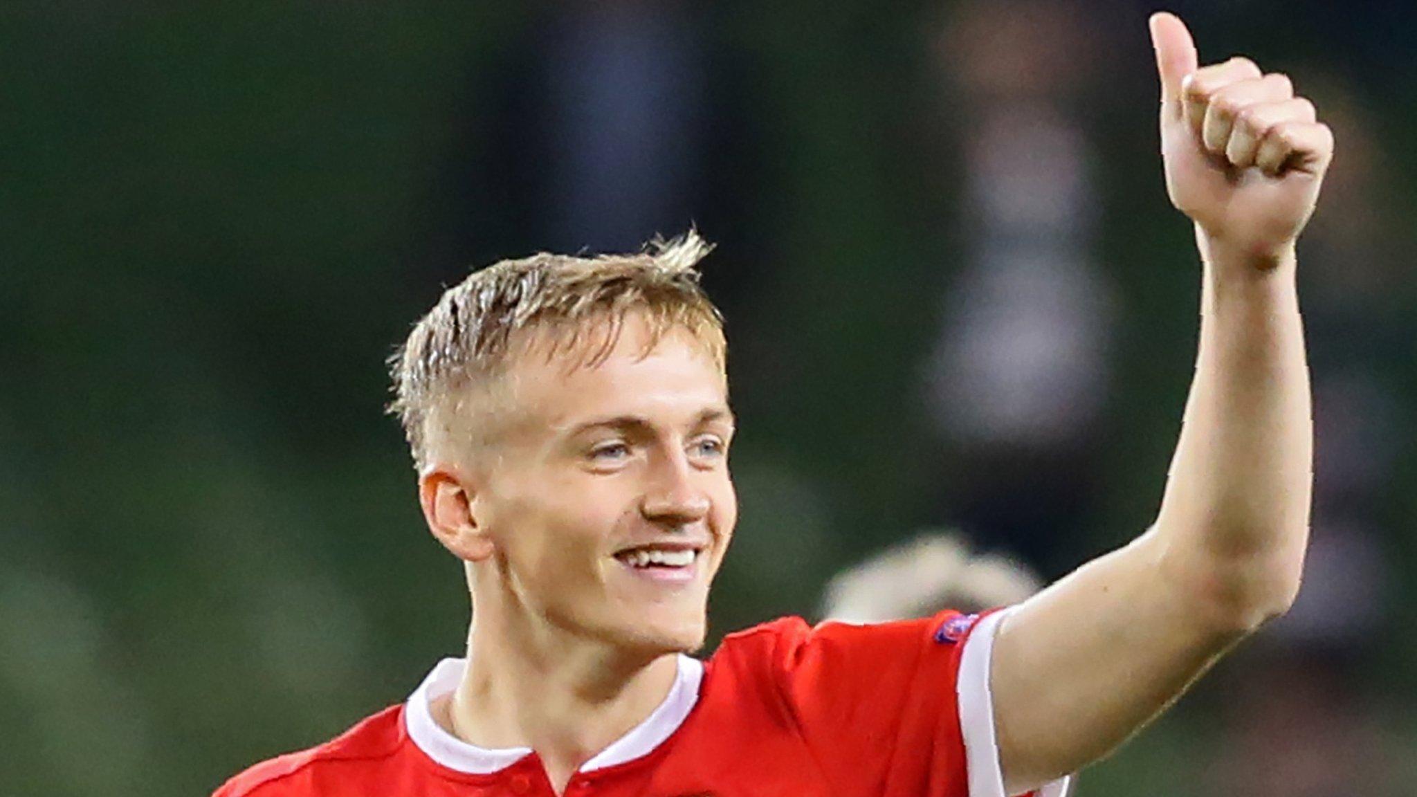 Matt Smith celebrates with Wales