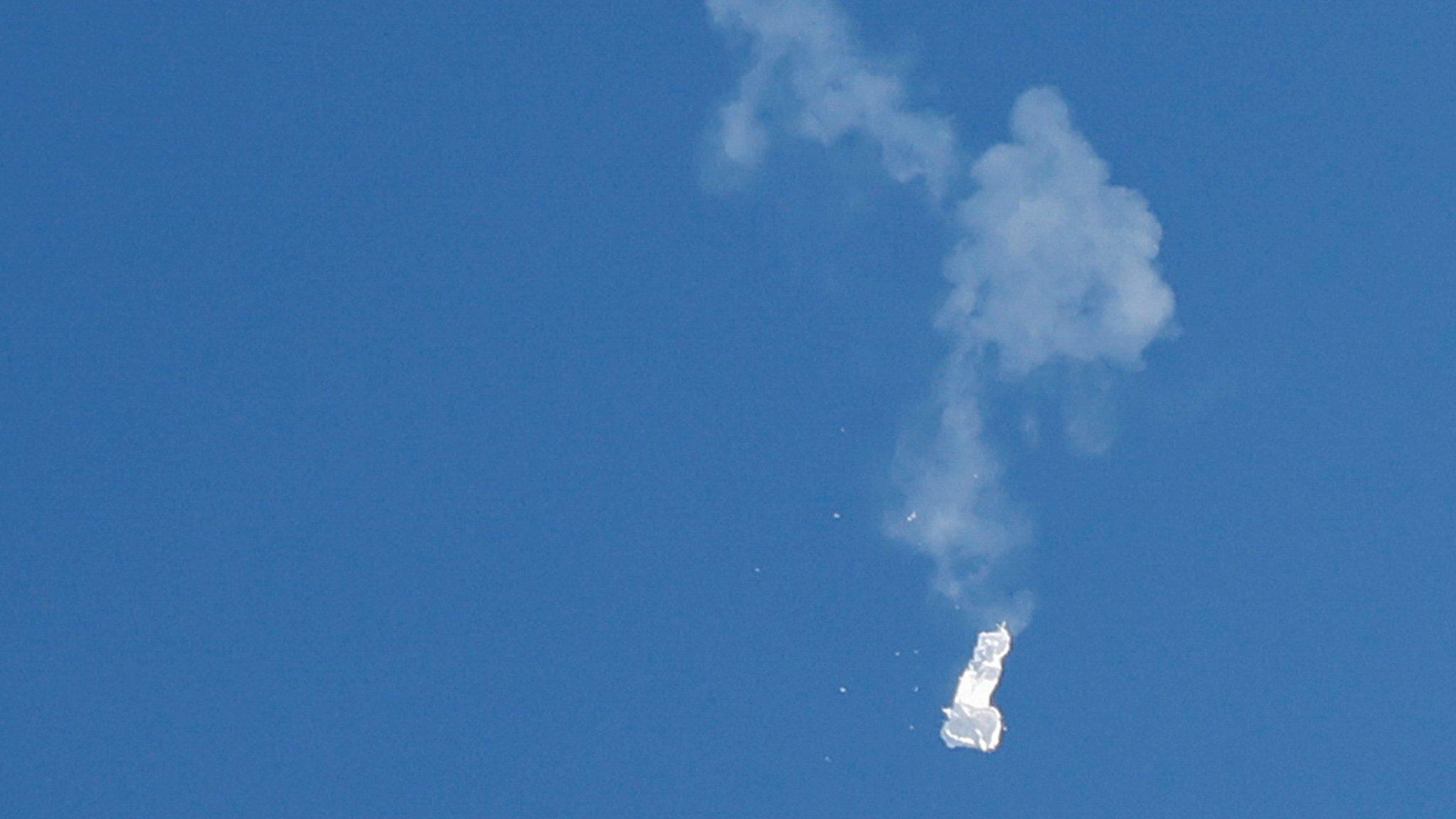 The balloon falling through the sky after being shoot down