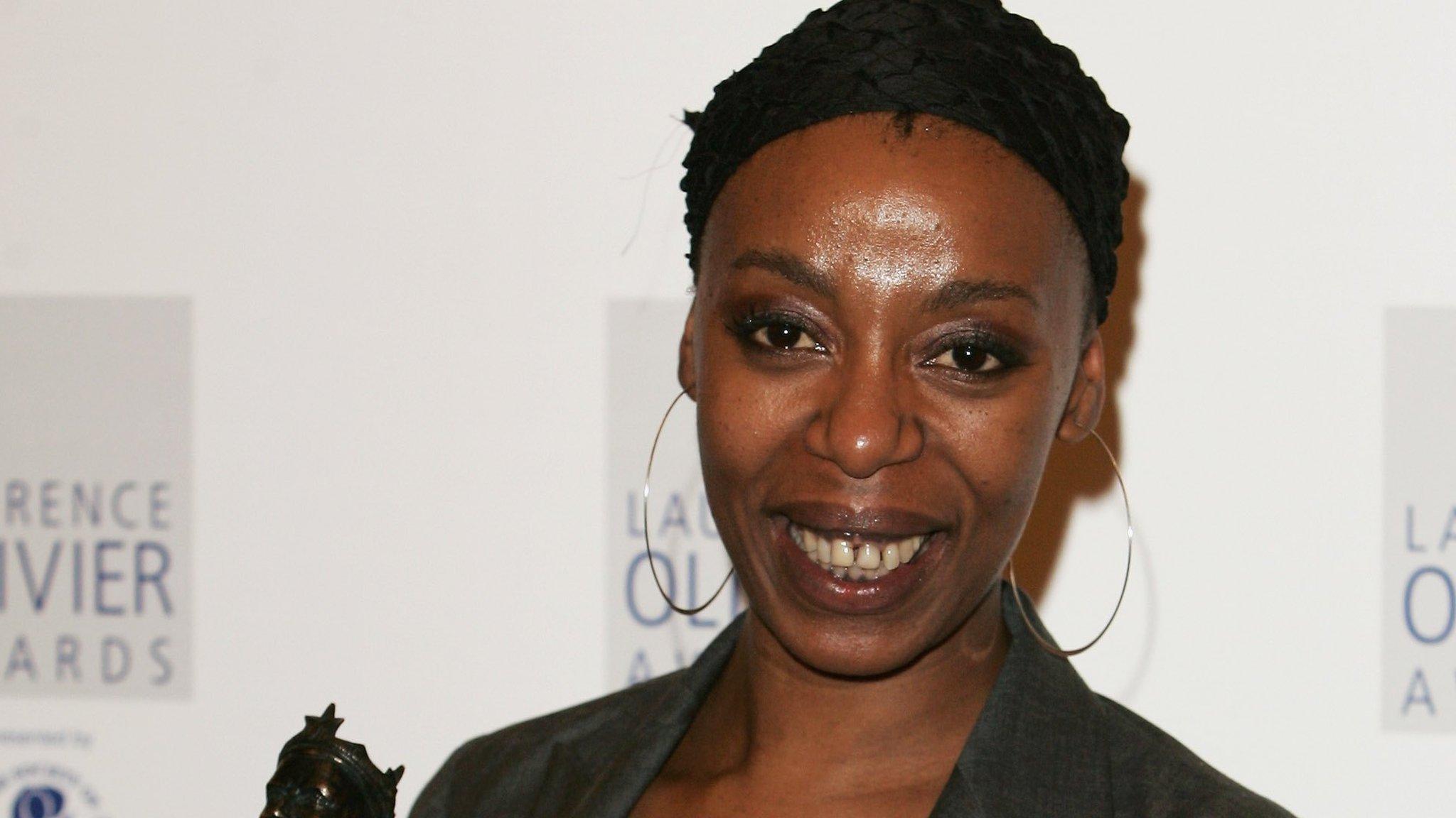 Noma Dumezweni poses with an award