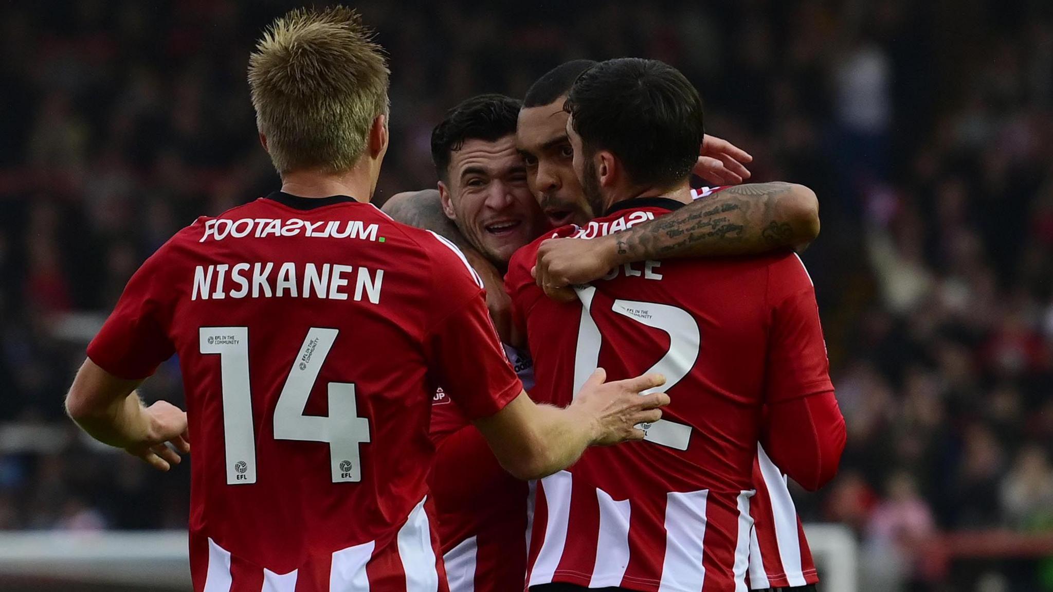 Exeter City celebrate a goal against Barnet