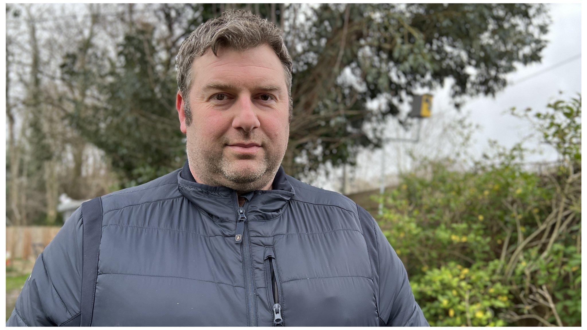 Nick Porter from High Garrett, stood next to a fake speed camera which he built from a bird box.