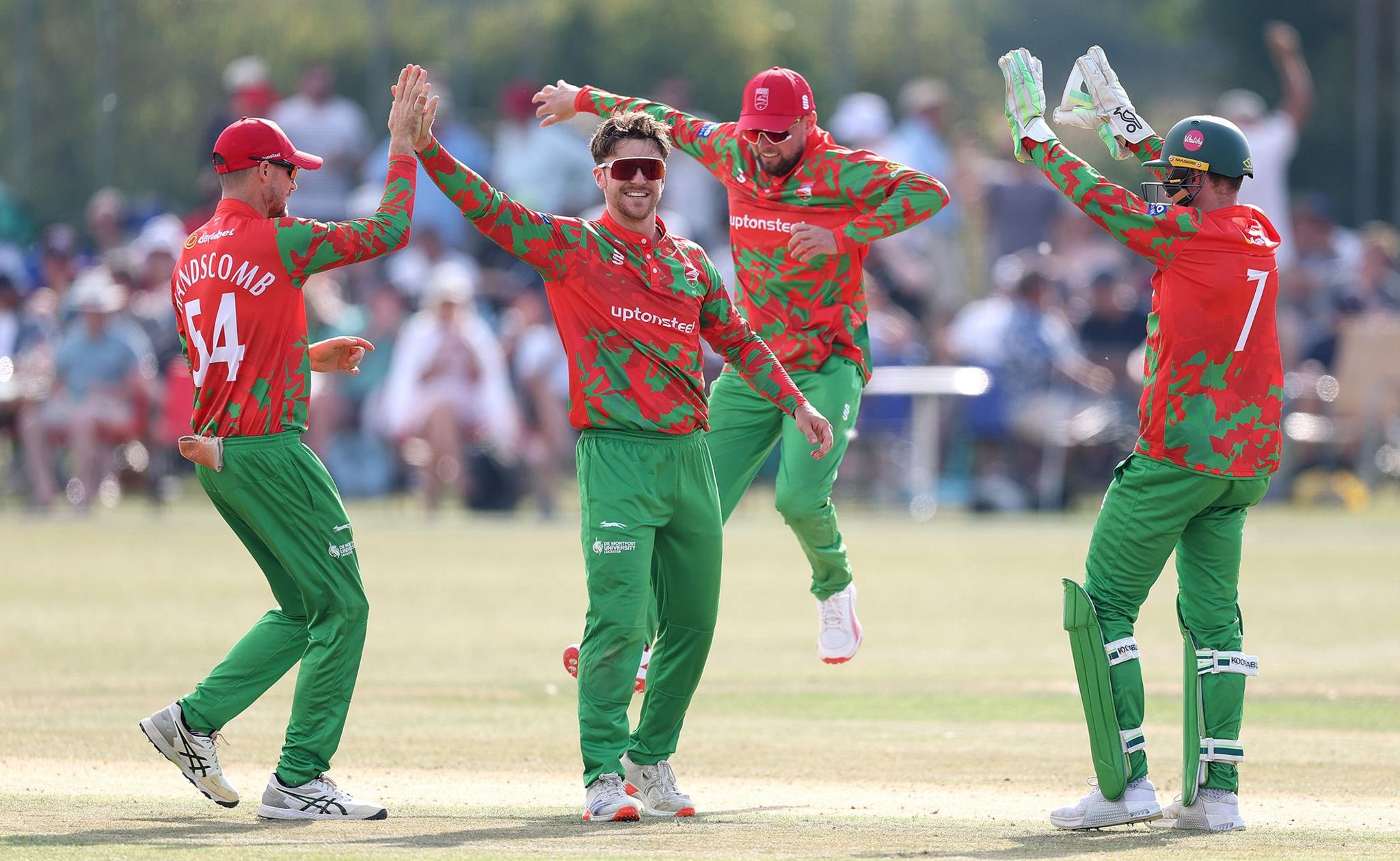 Leicestershire's Liam Trevaskis is congratulated after dismissing Nottinghamshire's Tom Moores during the Metro Bank One Day Cup match between Leicestershire Foxes and Nottinghamshire Outlaws at Kibworth CC in Leicester, England. Photo by Warren Little