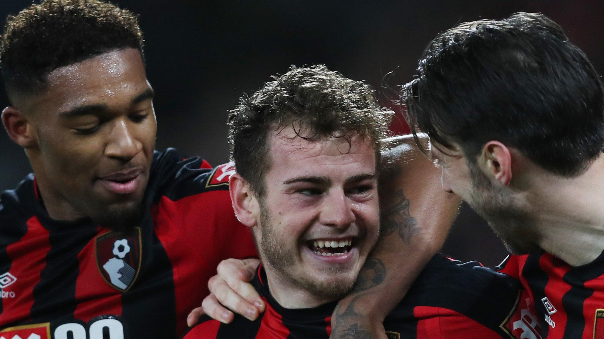 Ryan Fraser (centre) celebrates scoring the late winner for Bournemouth