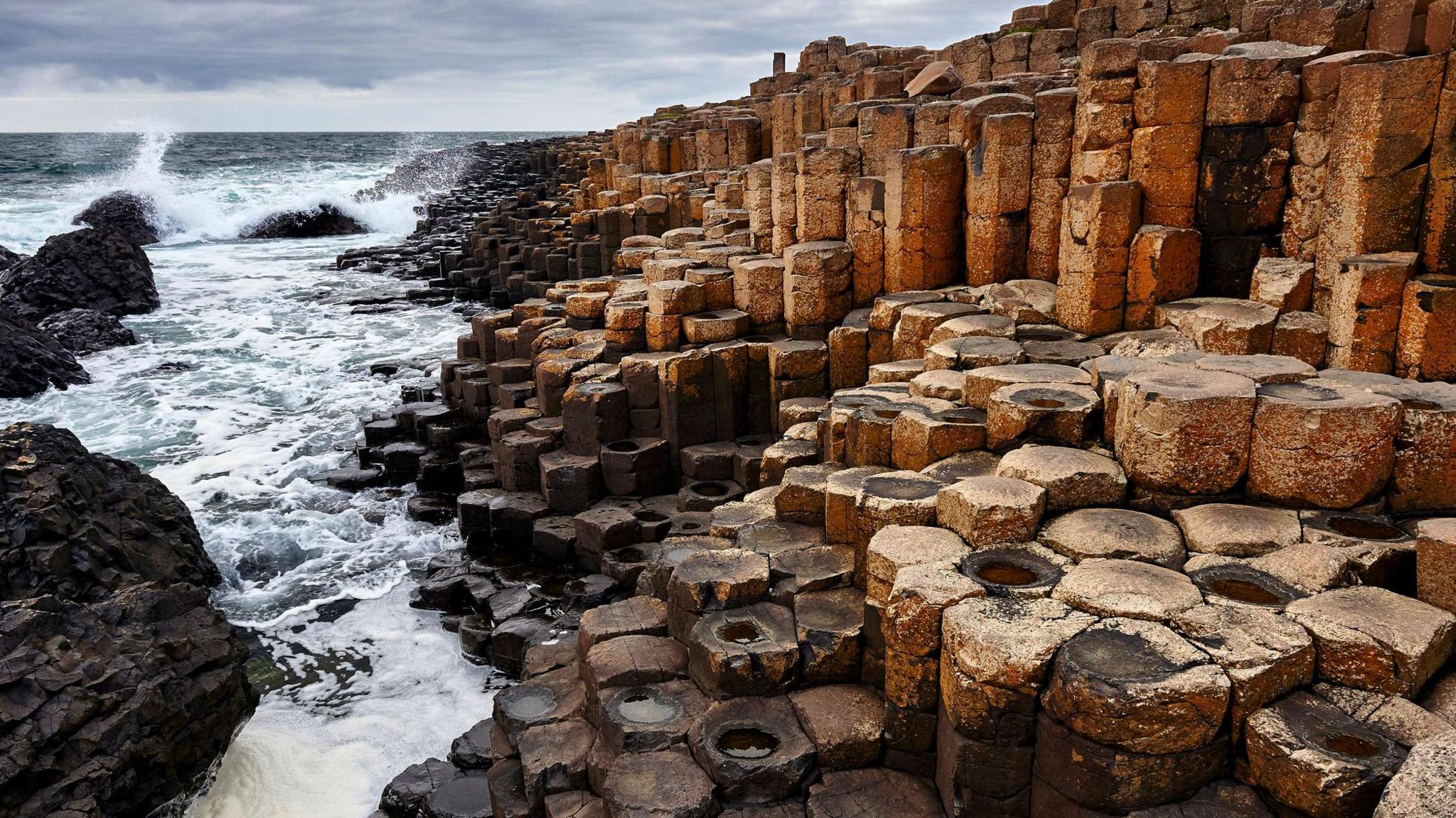 Waves against the Giant's Causeway rock formation in Northern Ireland