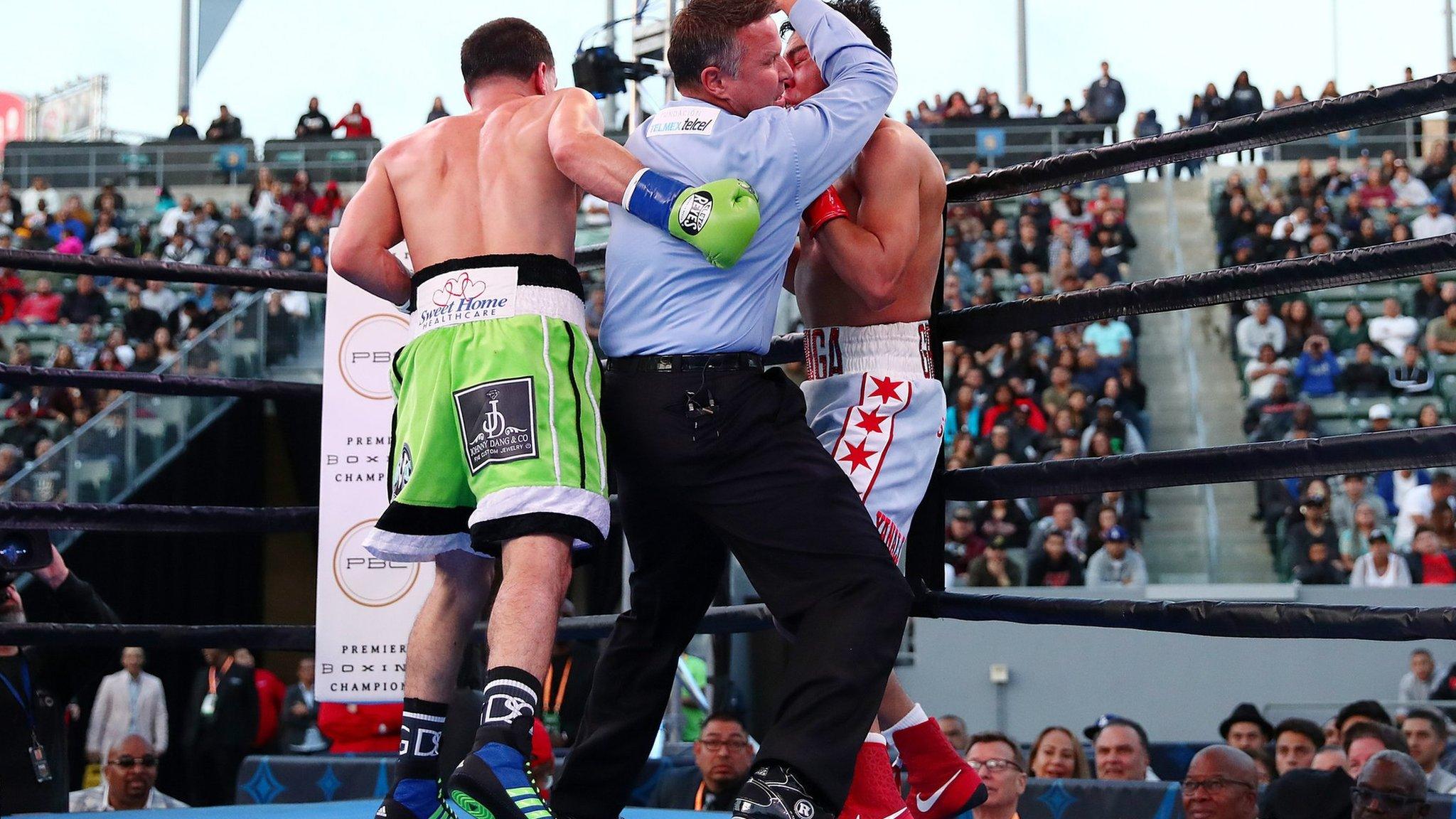 CARSON, CALIFORNIA - APRIL 20: The umpire stops the fight in the seventh round as Danny Garcia knocks out Adrian Granados during his WBC Silver welterweight championship bout at Dignity Health Sports Park on April 20, 2019 in Carson, California. (Photo by Yong Teck Lim/Getty Images)