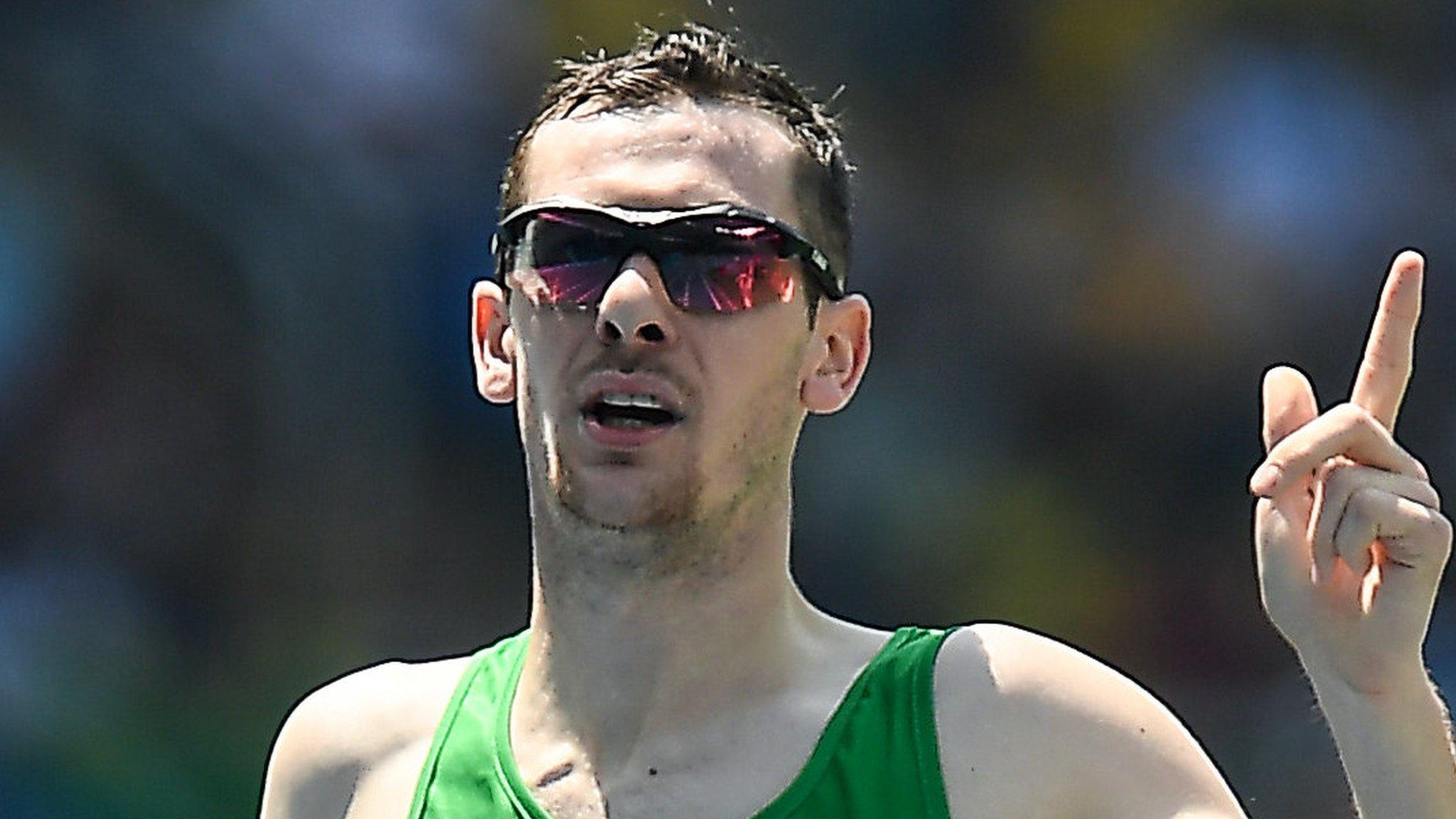 Michael McKillop celebrates after crossing the finishing line in Rio