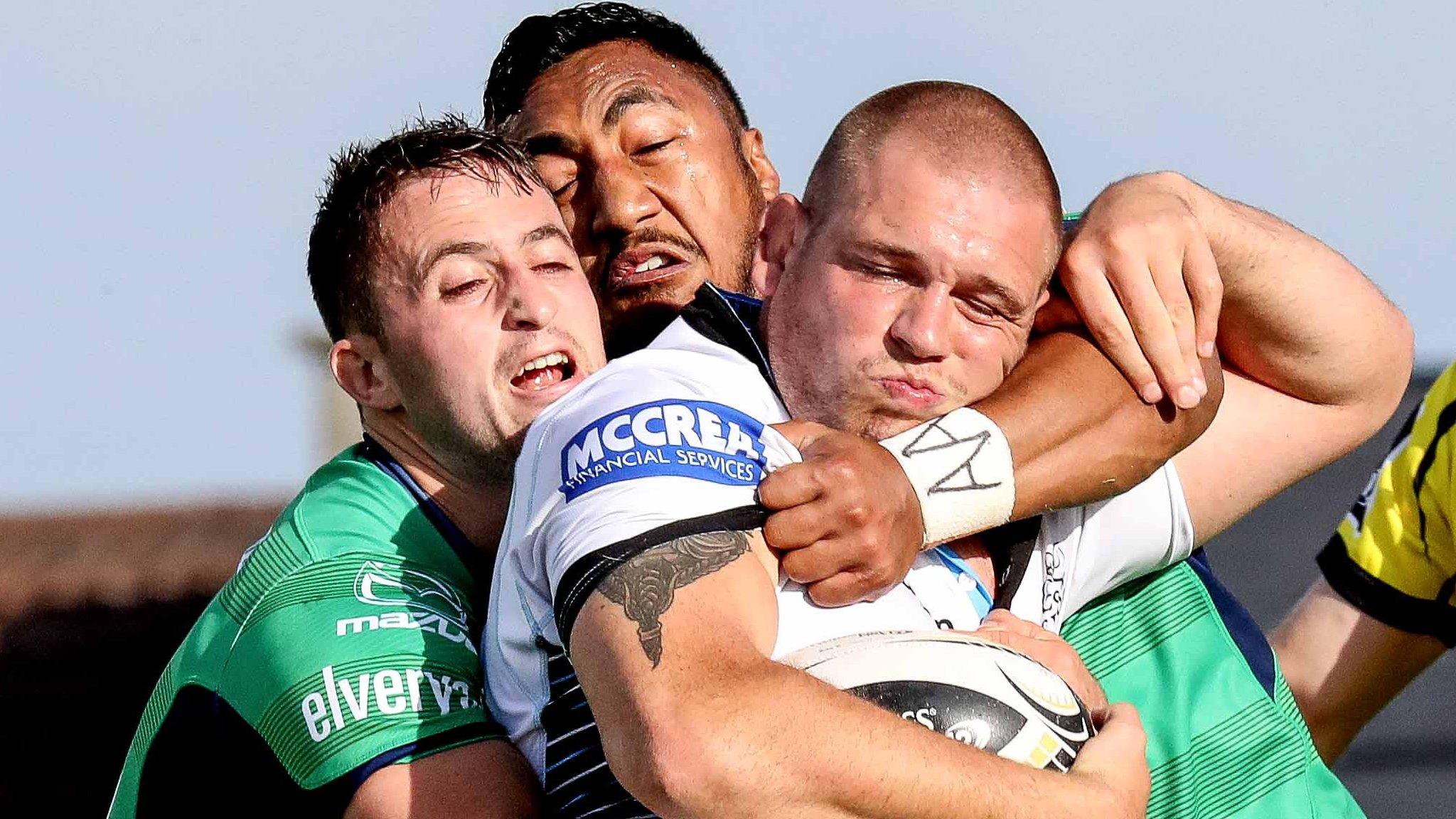 Glasgow's Gordon Reid is tackled by Caolin Blade and Bundee Aki of Connacht