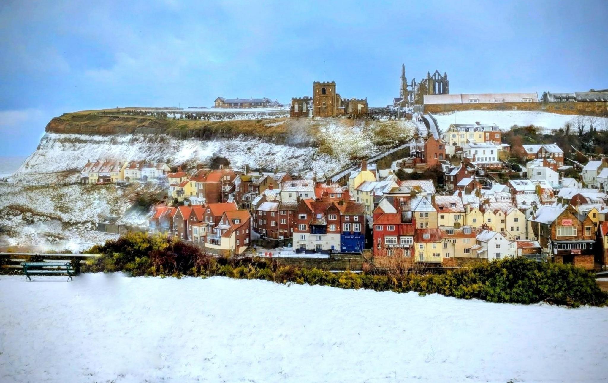 Houses in the foothills of North Yorkshire covered in snow