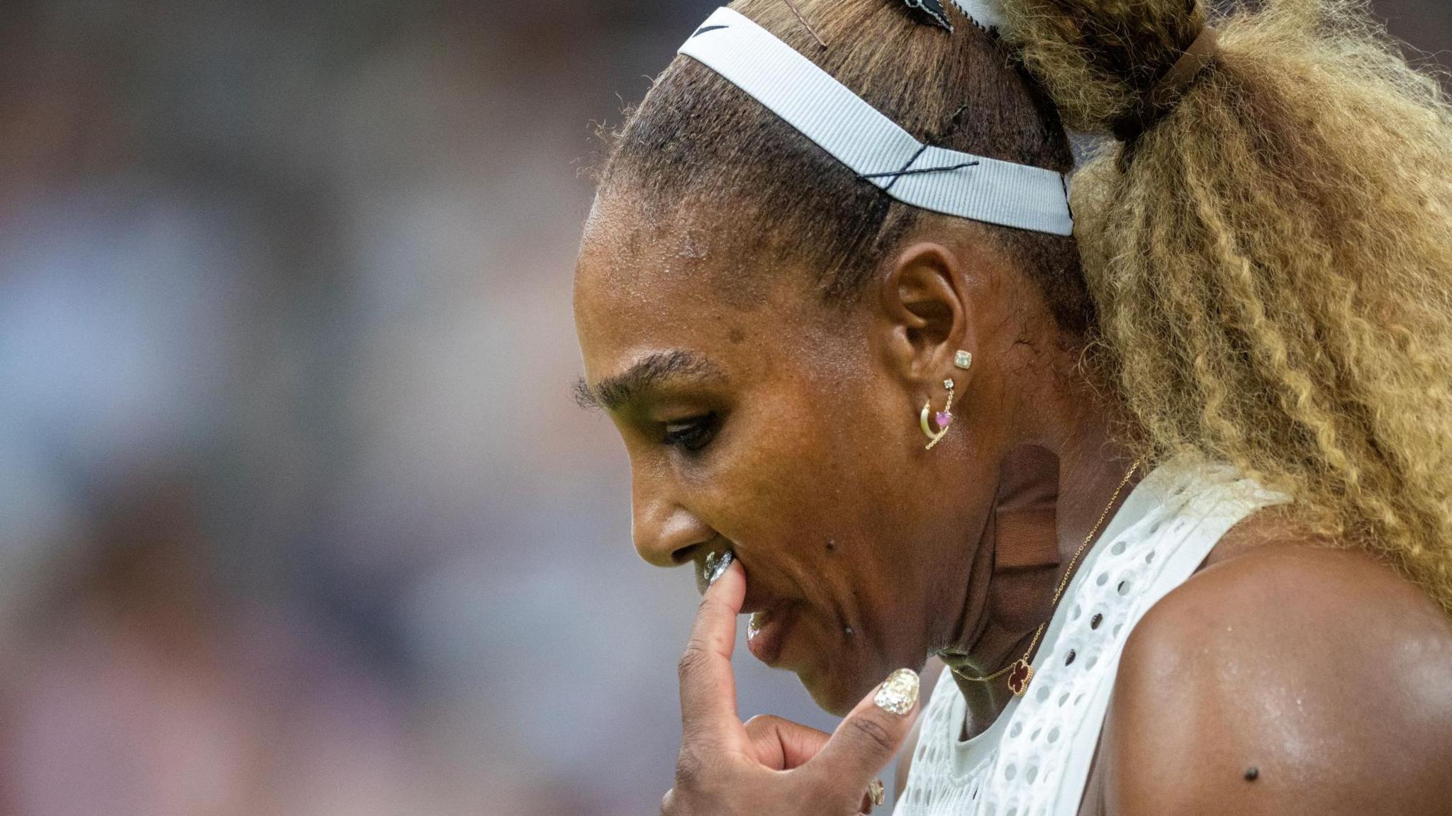 Serena Williams reacts during her Wimbledon defeat