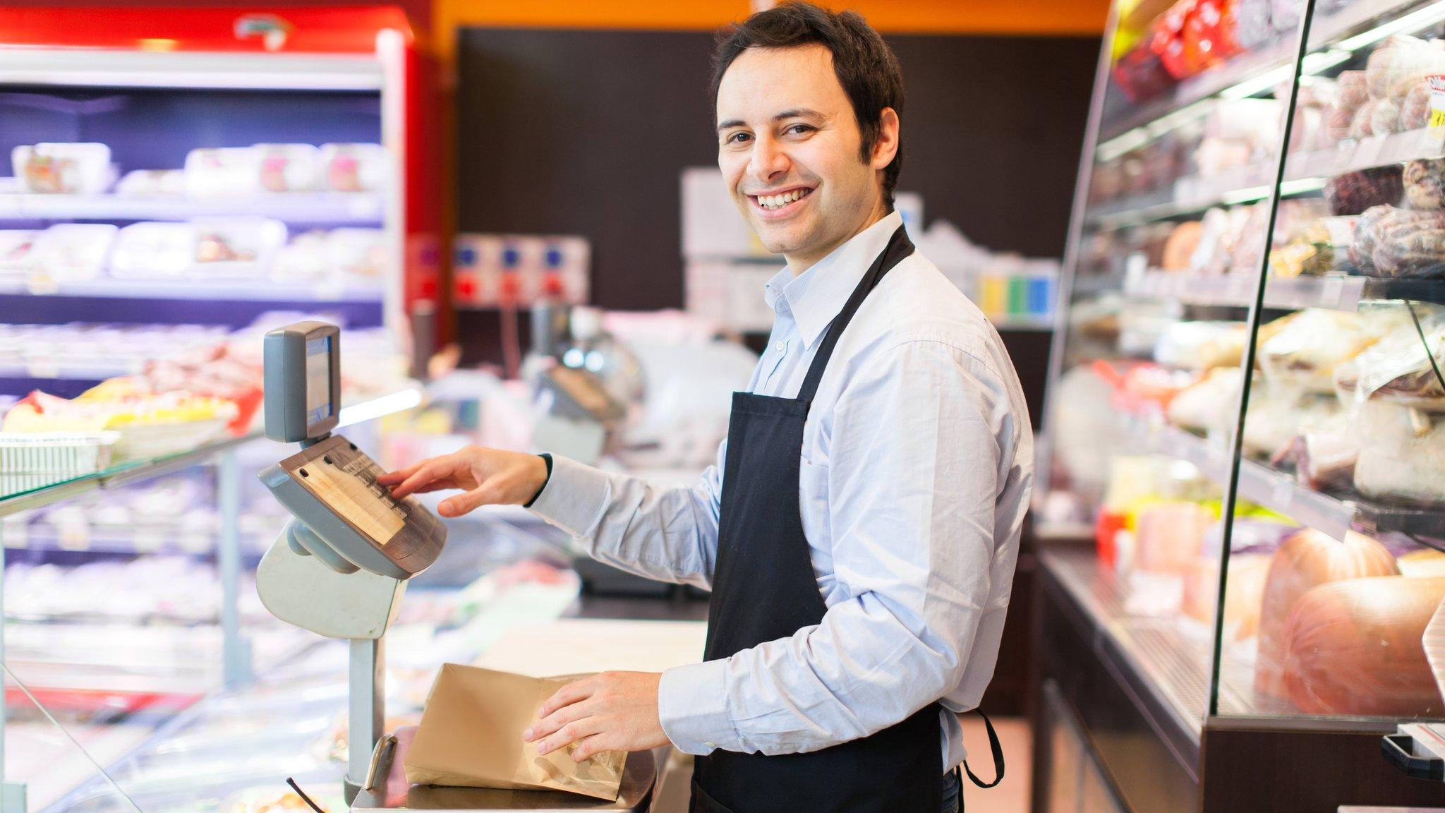 Man working at deli counter