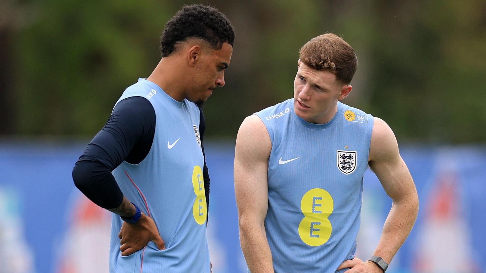  Morgan Rogers and Elliot Anderson of England interact during a training session