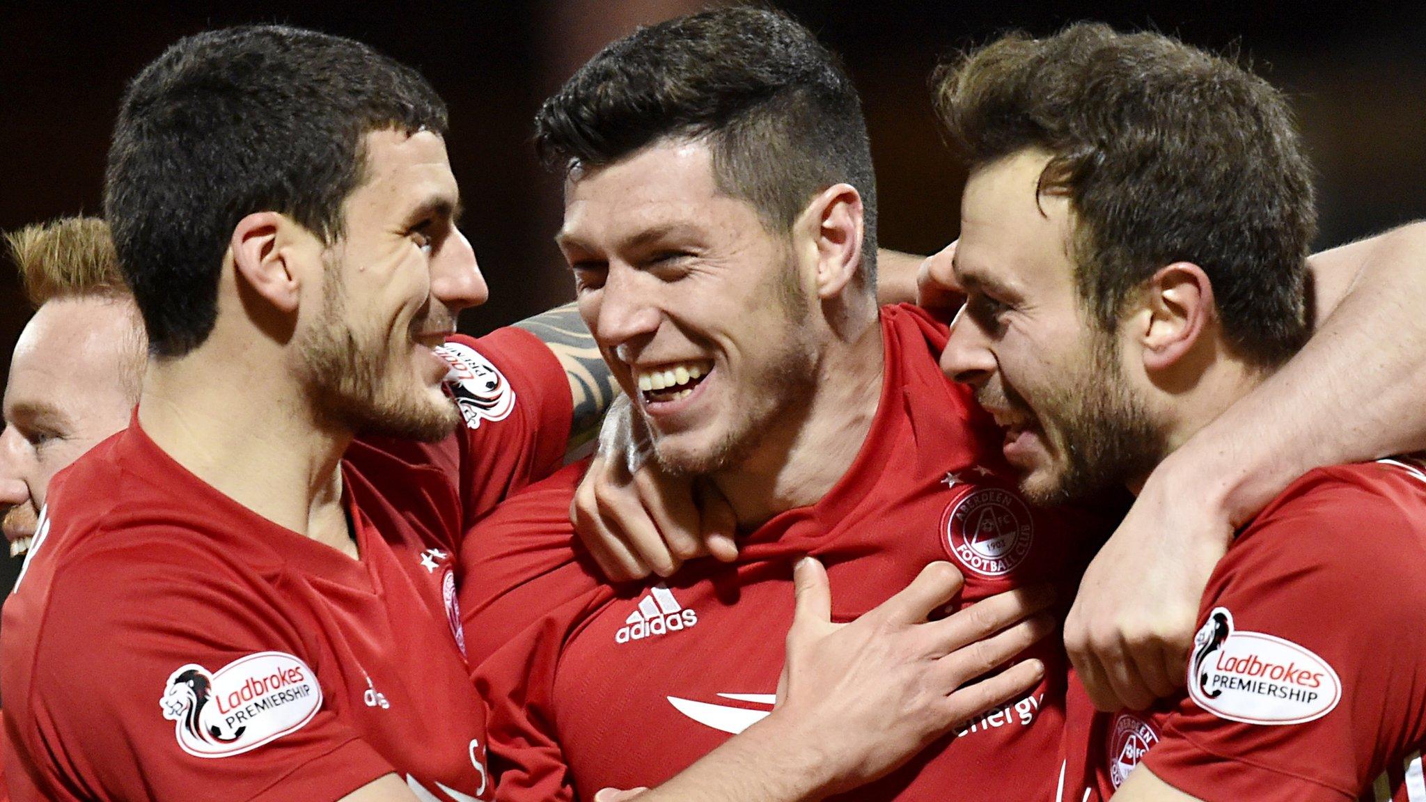 Aberdeen celebrate the goal from Scott McKenna (centre)