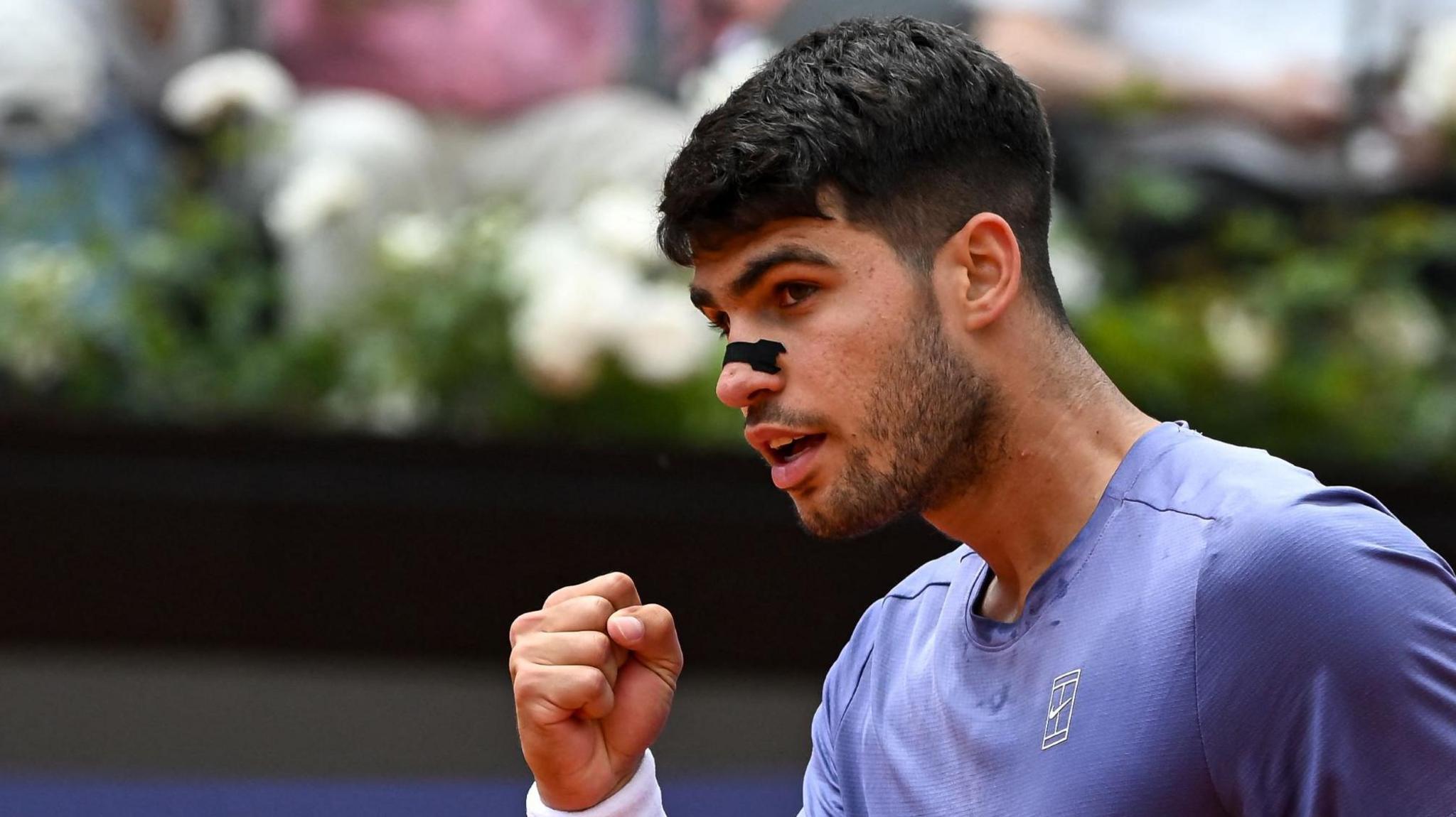 Carlos Alcaraz celebrates winning a point at the Italian Open