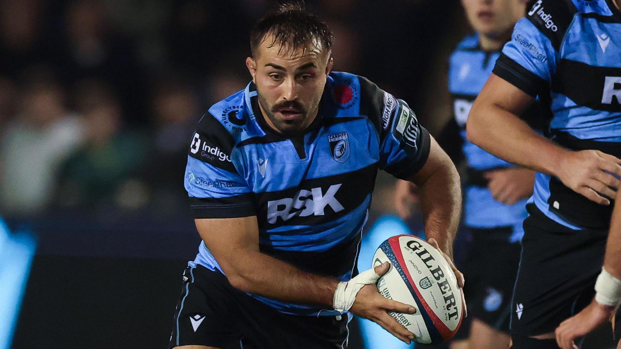 Cardiff hooker Liam Belcher carries the ball