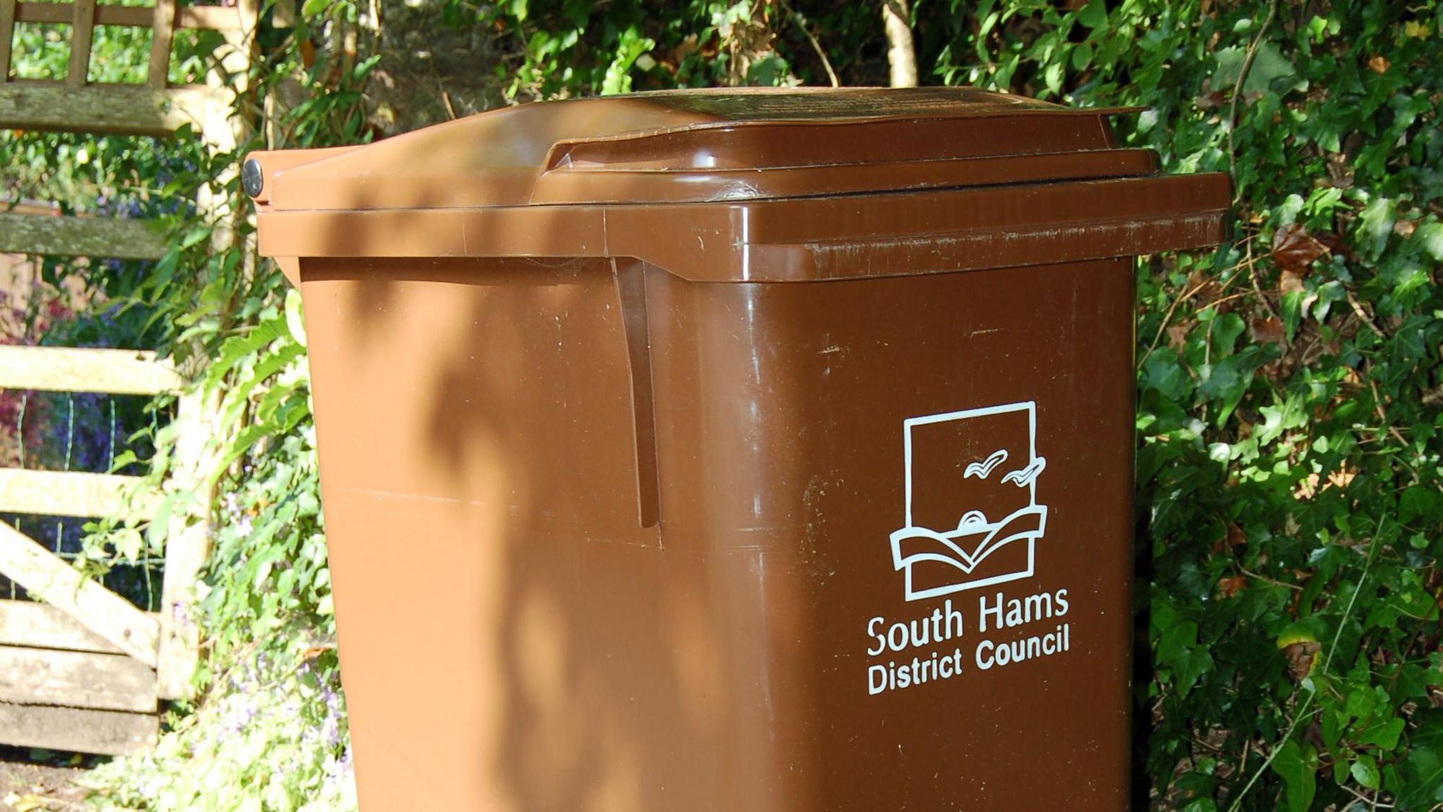 A brown wheelie bin in Devon designed to take household waste and garden clippings to be recycled