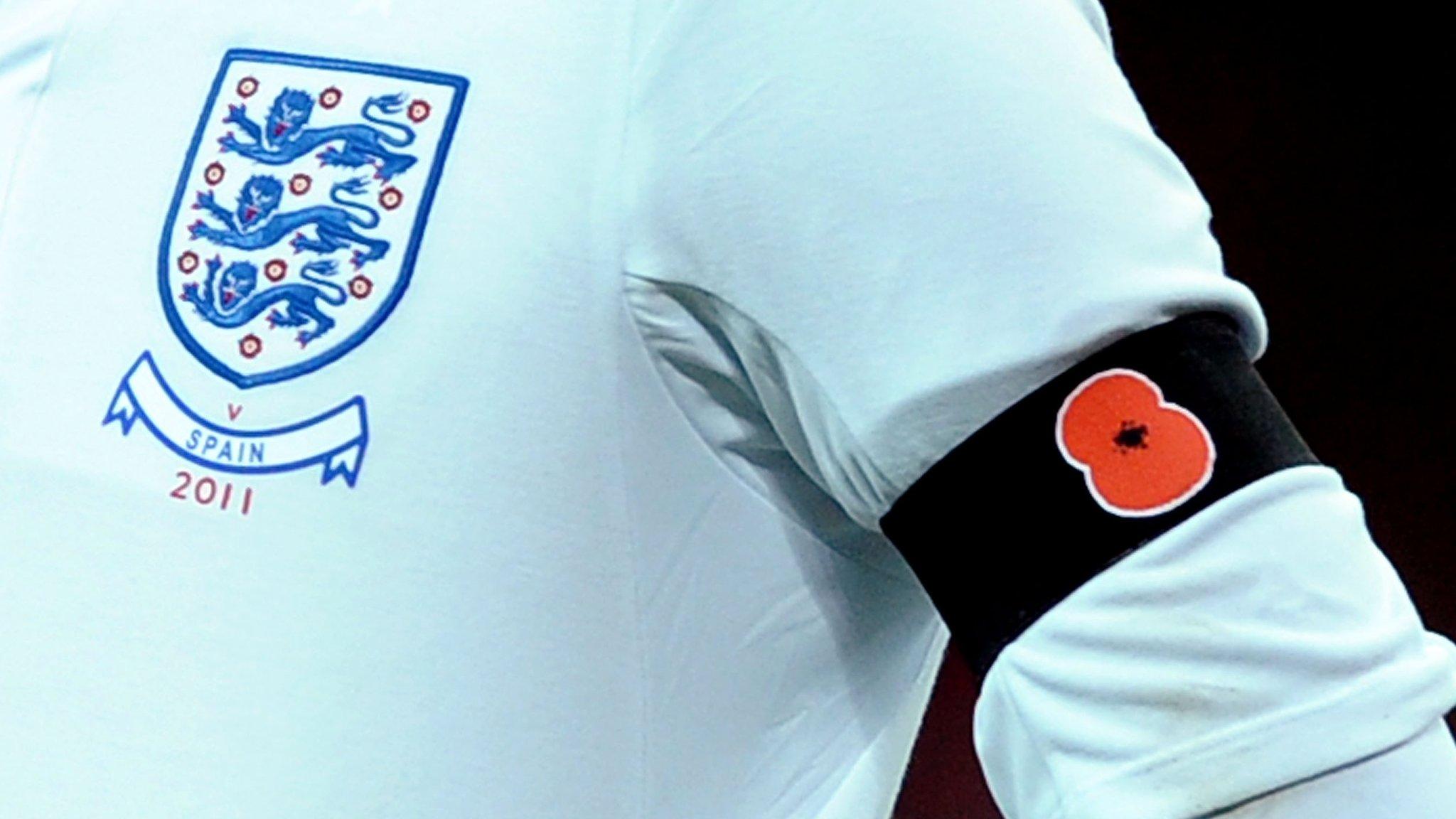 England player wearing poppy armband