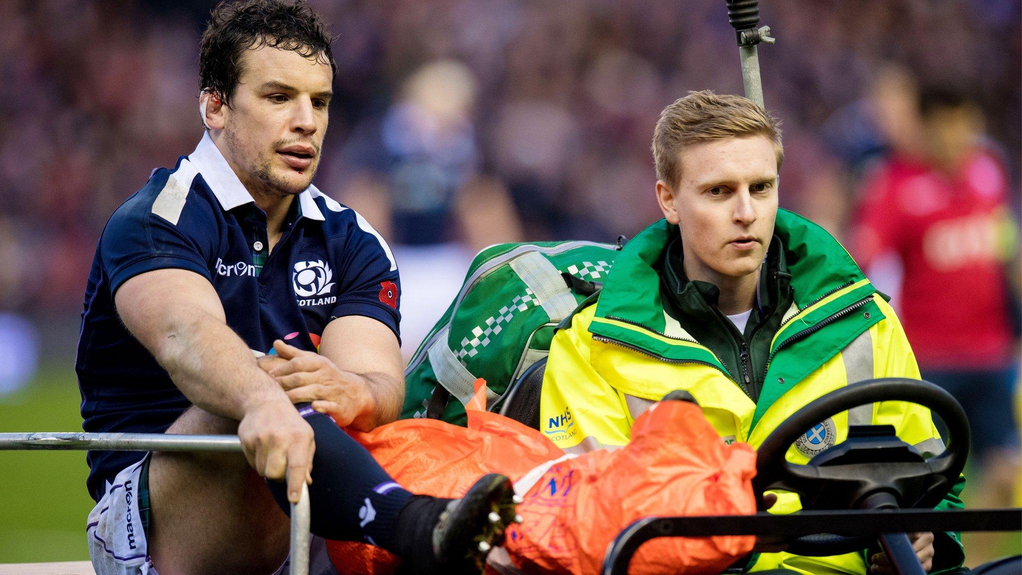 Scotland's John Hardie is taken off on a stretcher