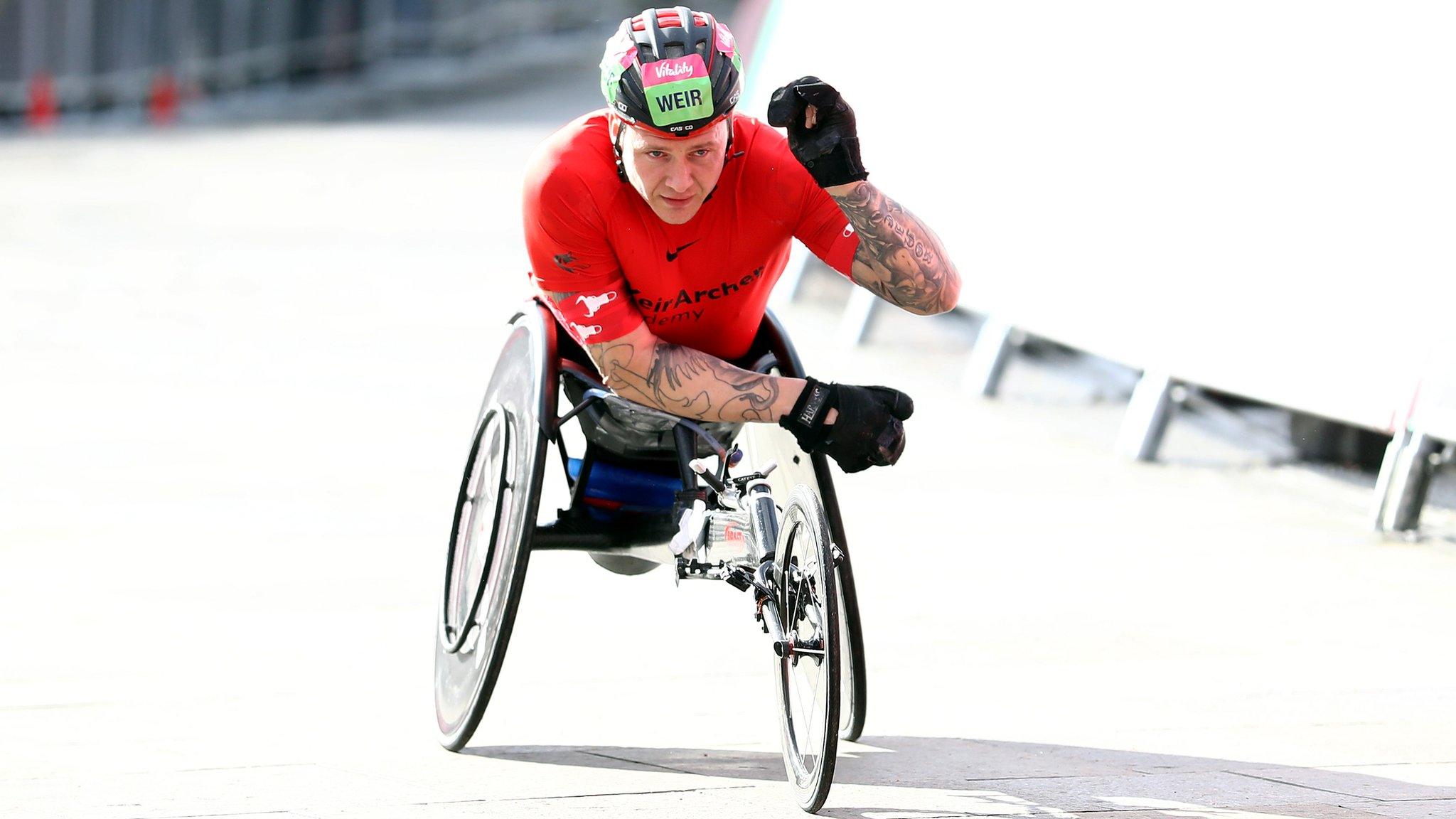 David Weir of Great Britain celebrates as he crosses the line after winning the Elite Men's Wheelchair race in the men's Vitality Big Half