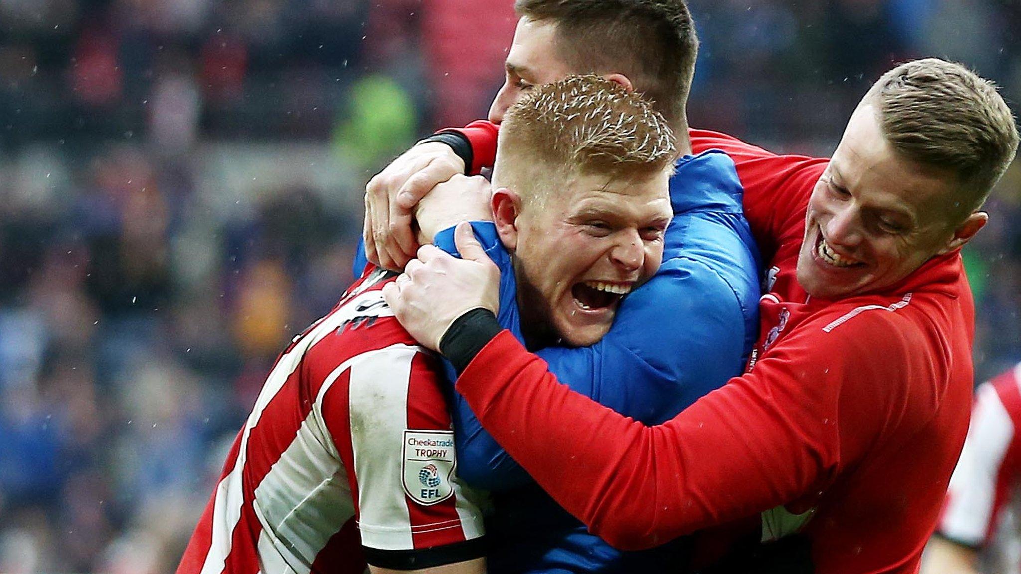 Lincoln City player's celebrate victory