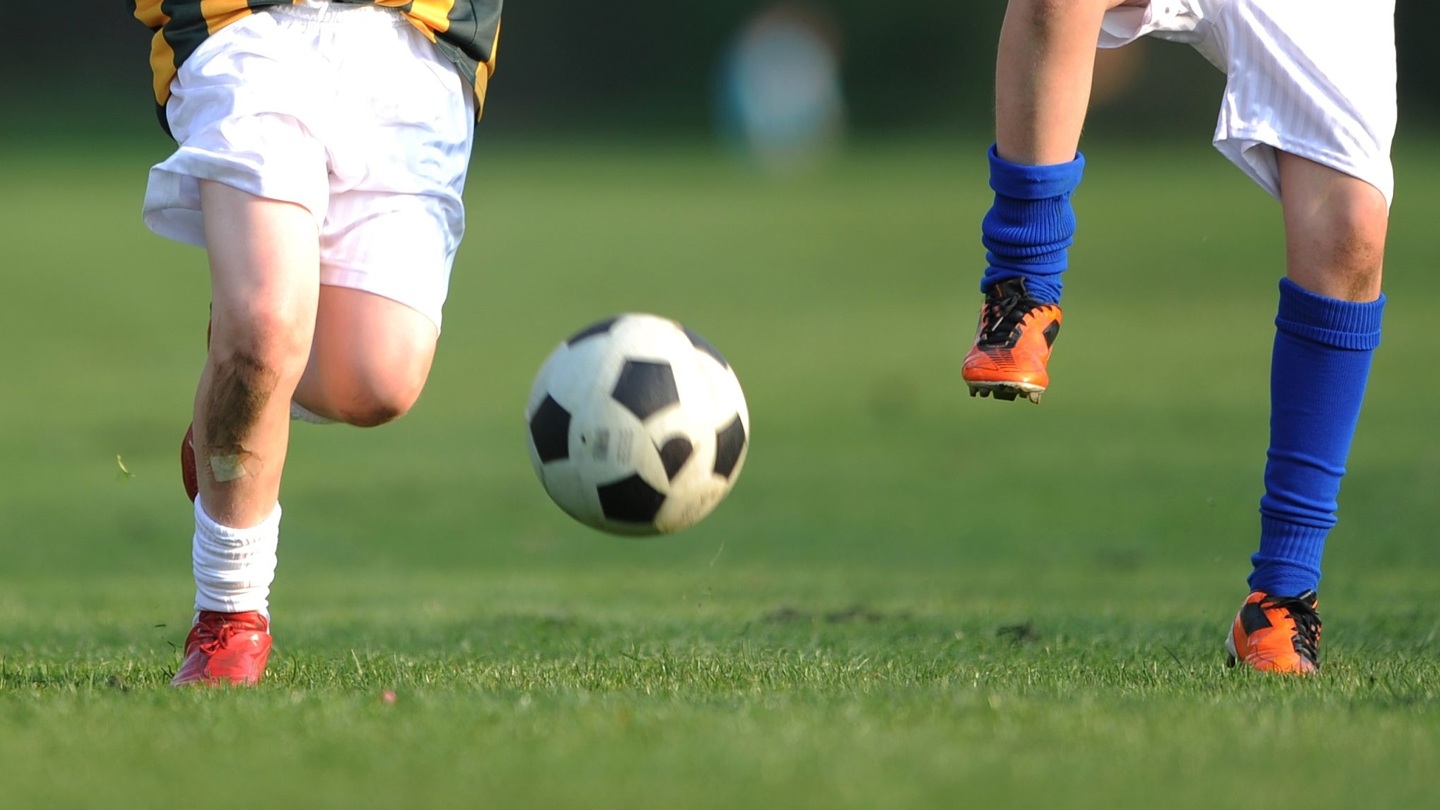 Kids playing football