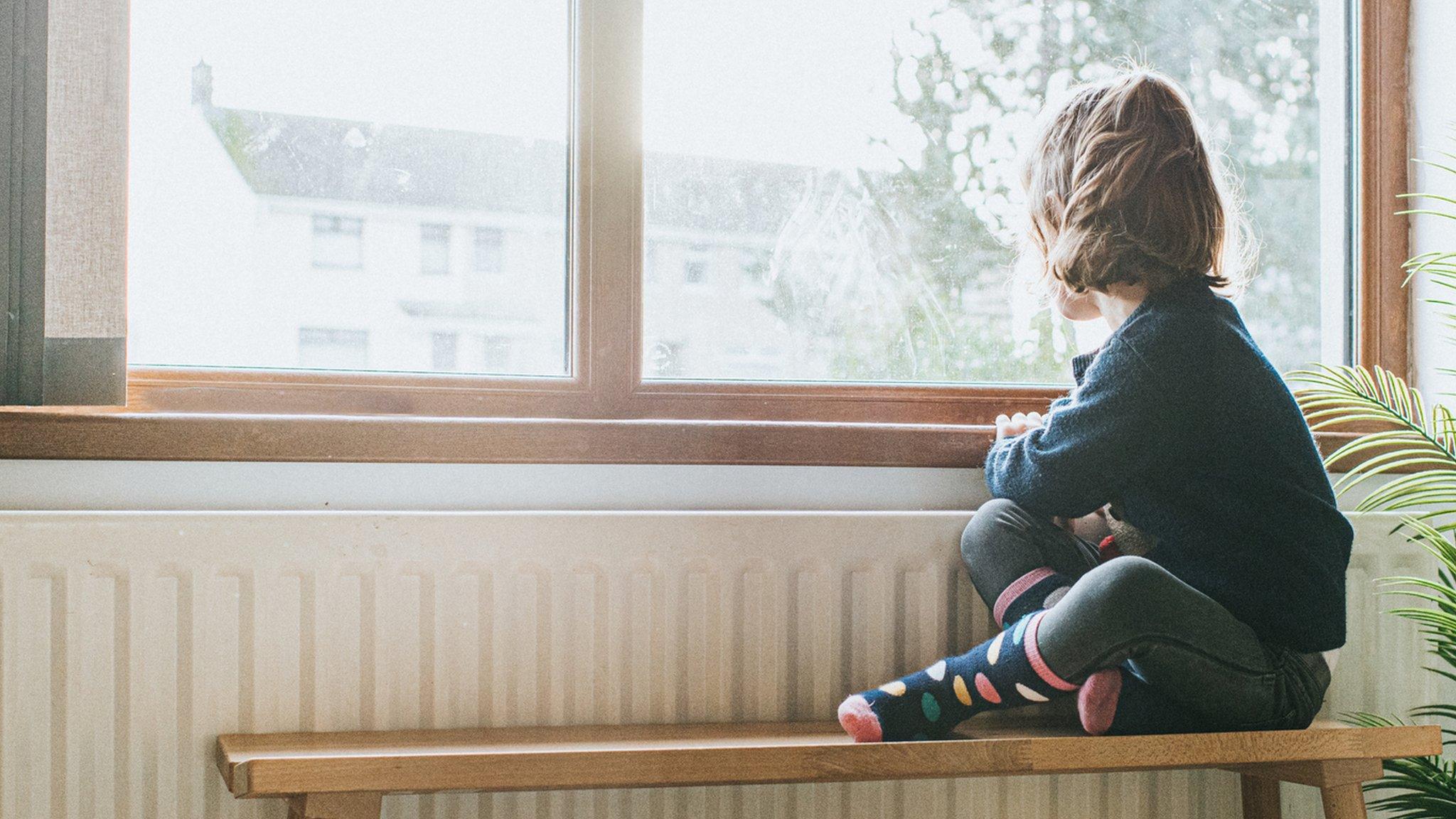 Child looking out of the window