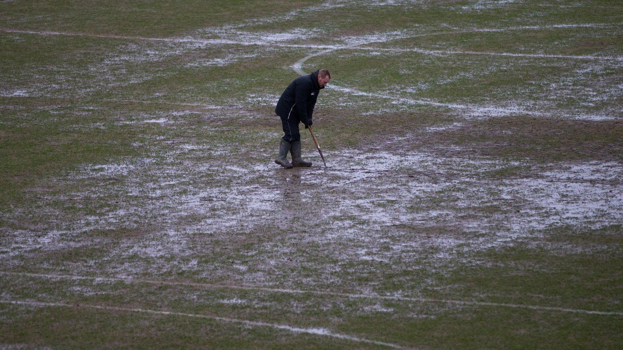 A groundsman works on the Rodney Parade
