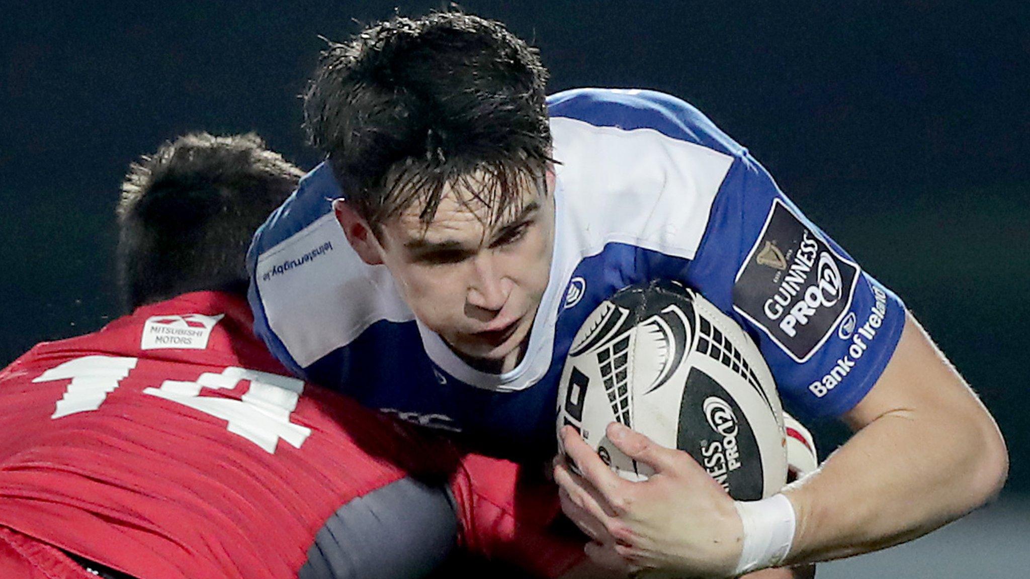 Damien Hoyland of Edinburgh challenges Leinster fly-half Joey Carbery