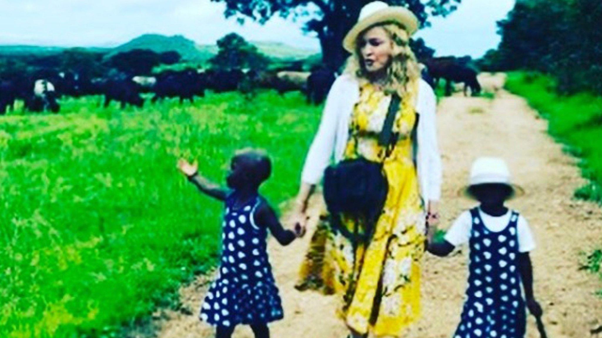 Madonna with her adopted twin girls - in her Instagram post