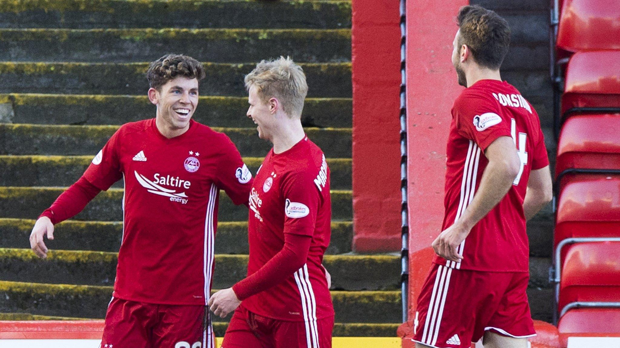 Aberdeen's Ryan Christie celebrates with Gary Mackay-Steven and Andrew Considine