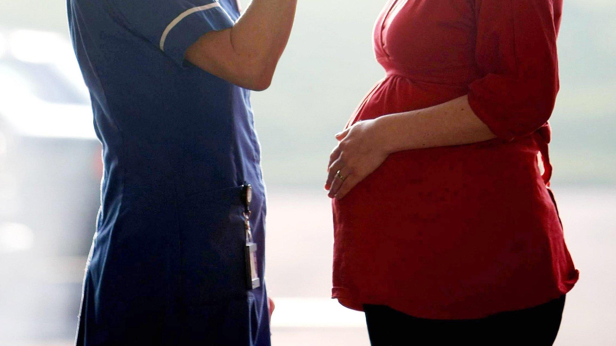 Pregnant woman with a midwife