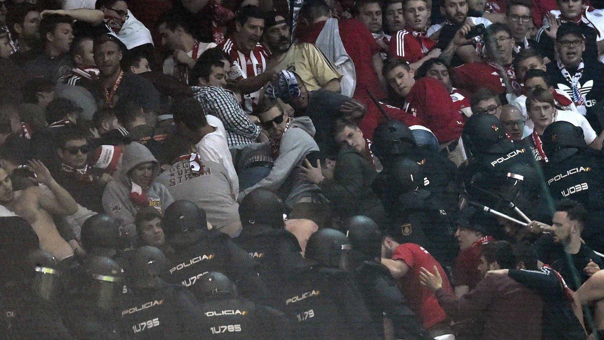 Spanish riot police clashed with Bayern Munich fans during the Champions League quarter-final at Real Madrid on 18 April