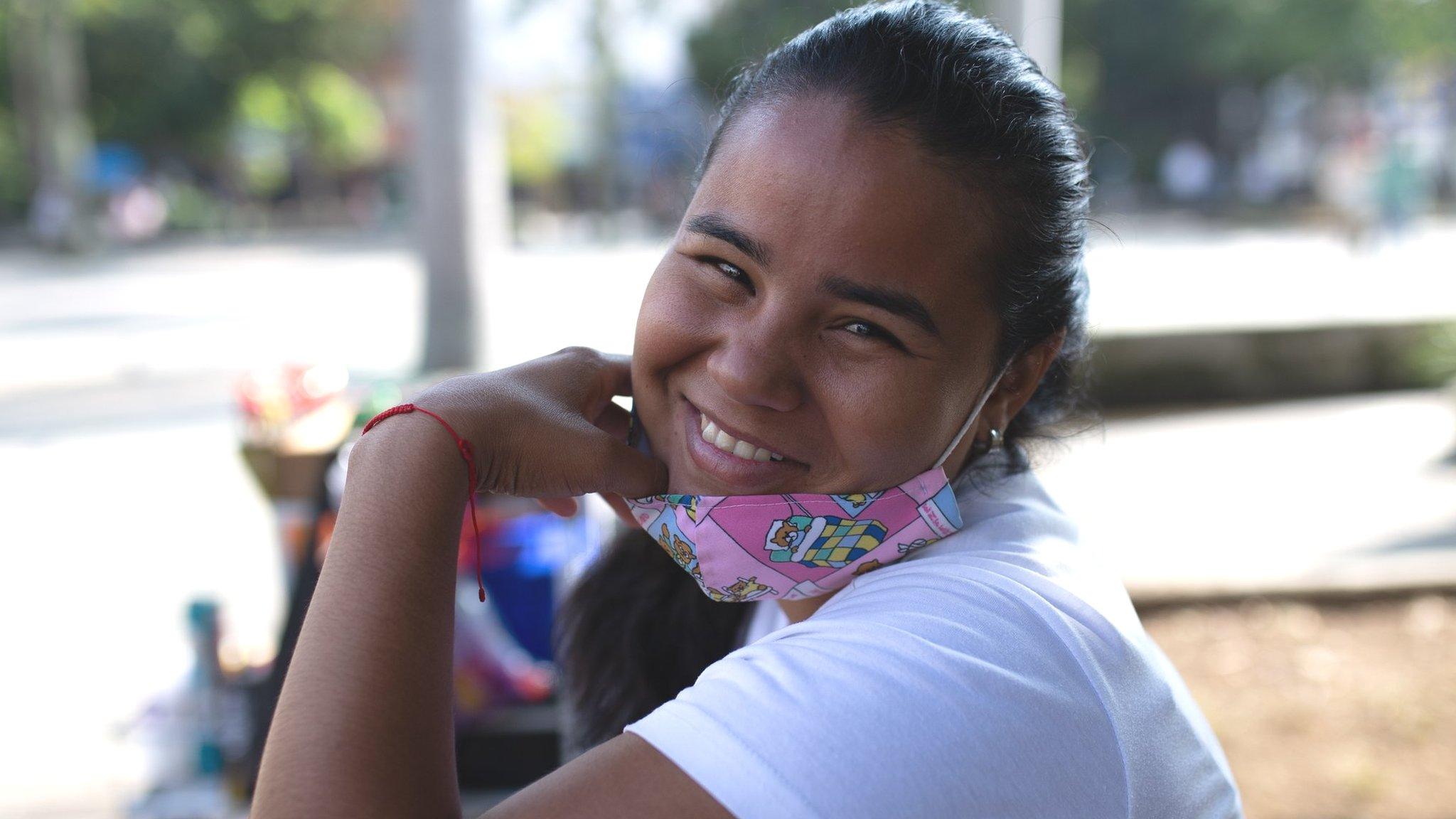 Venezuelan migrant Danexi Andrade poses for a photo in Medellin