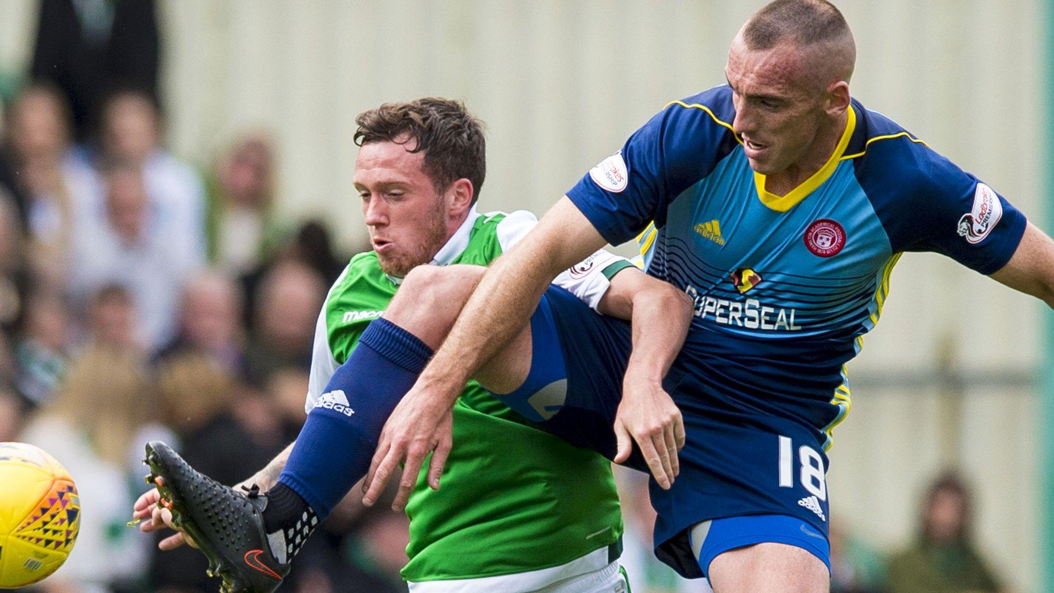 Danny Swanson is challenged by Accies midfielder Darian MacKinnon