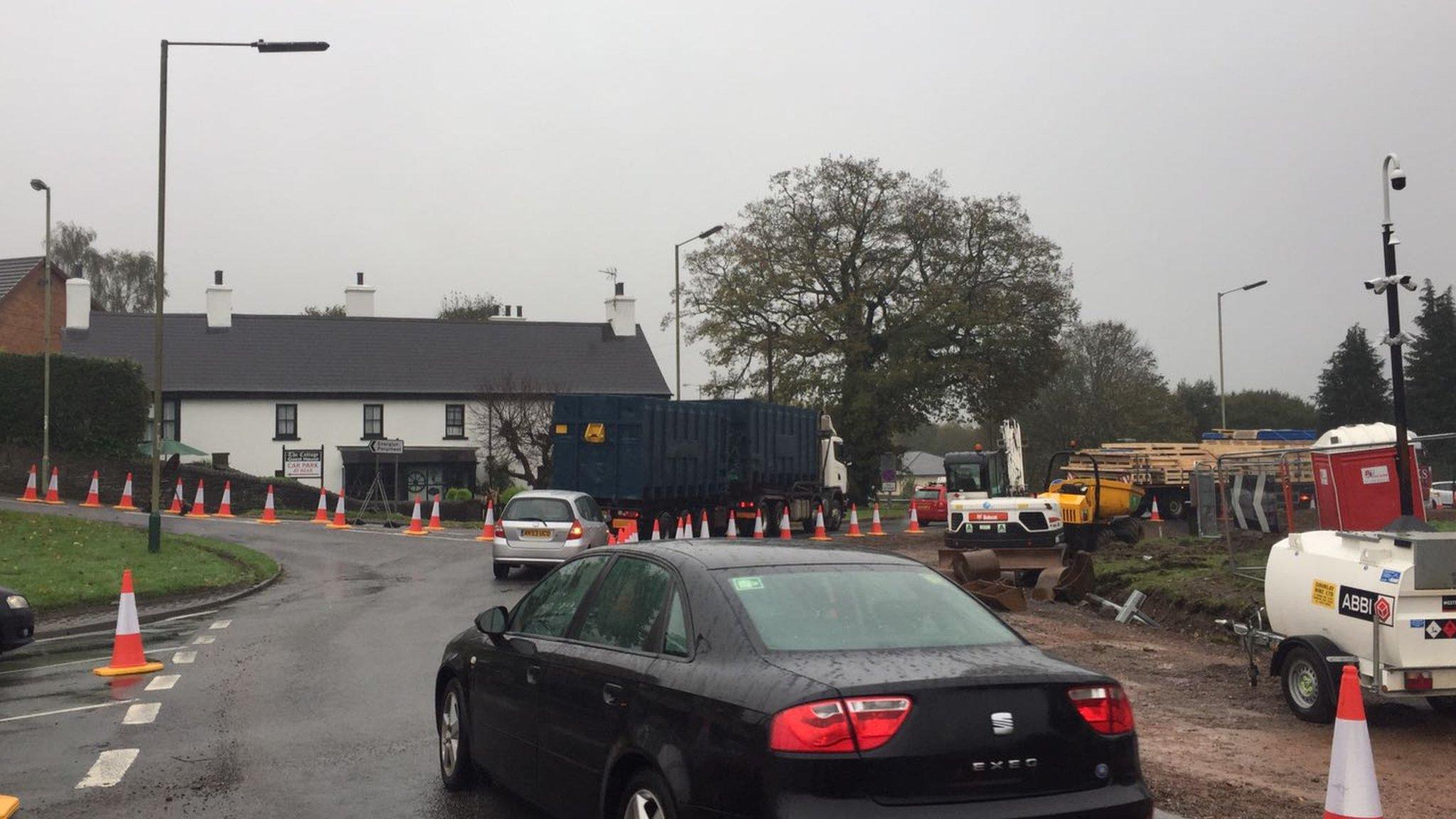 A picture of a car on a congested roundabout