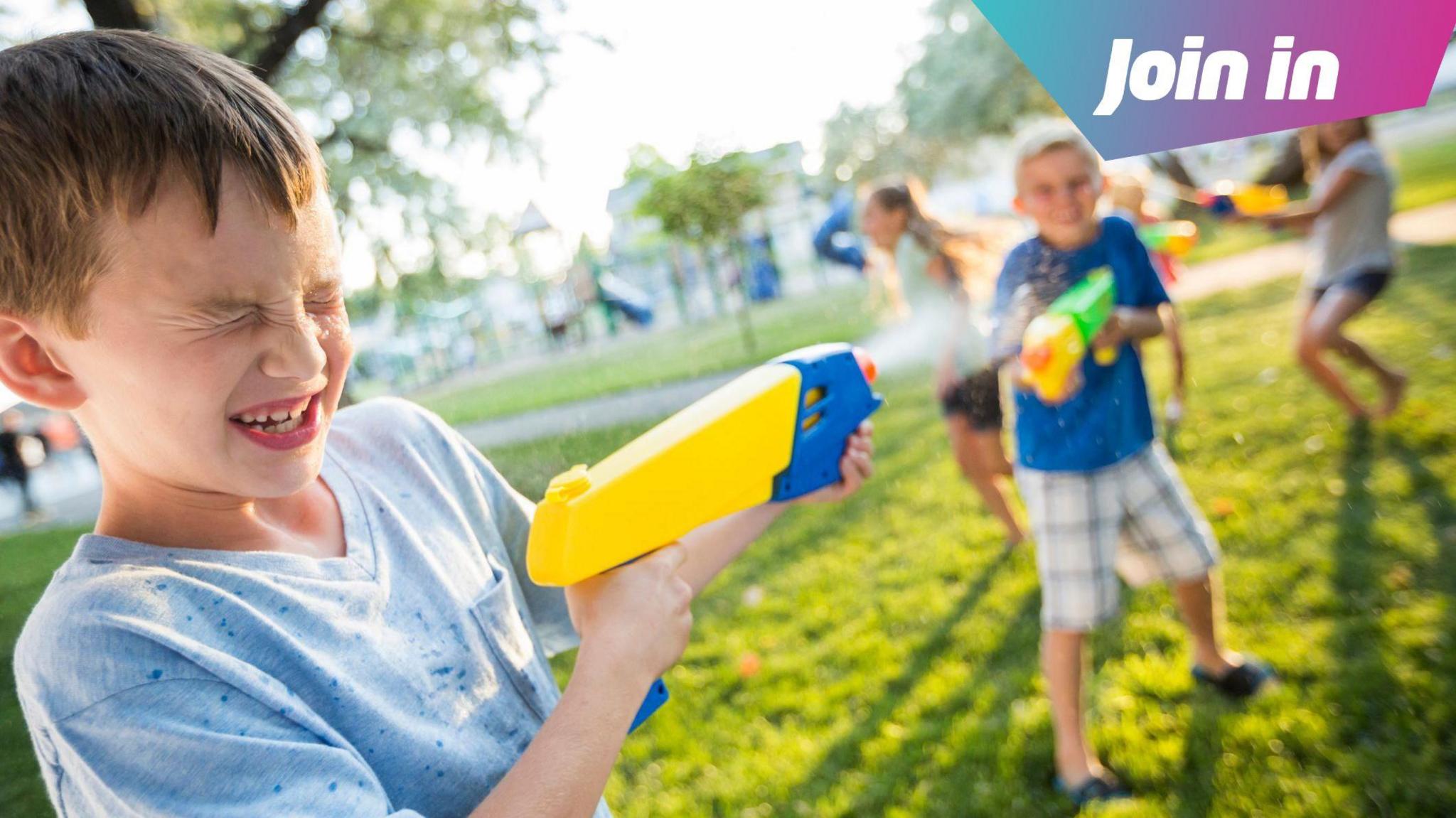 Children enjoying a water fight.