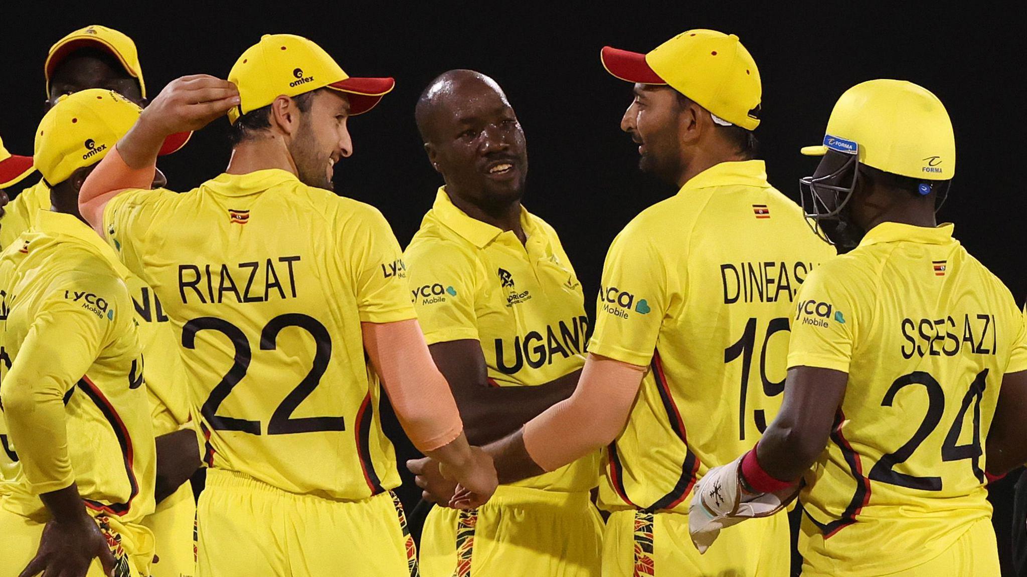 Frank Nsubuga celebrates with teammates after a successful DRS review to dismiss Hiri Hiri of Papua New Guinea LBW during the ICC Men's T20 Cricket World Cup West Indies & USA 2024 match between Papua New Guinea and Uganda at Providence Stadium on June 05, 2024 in Georgetown, Guyana