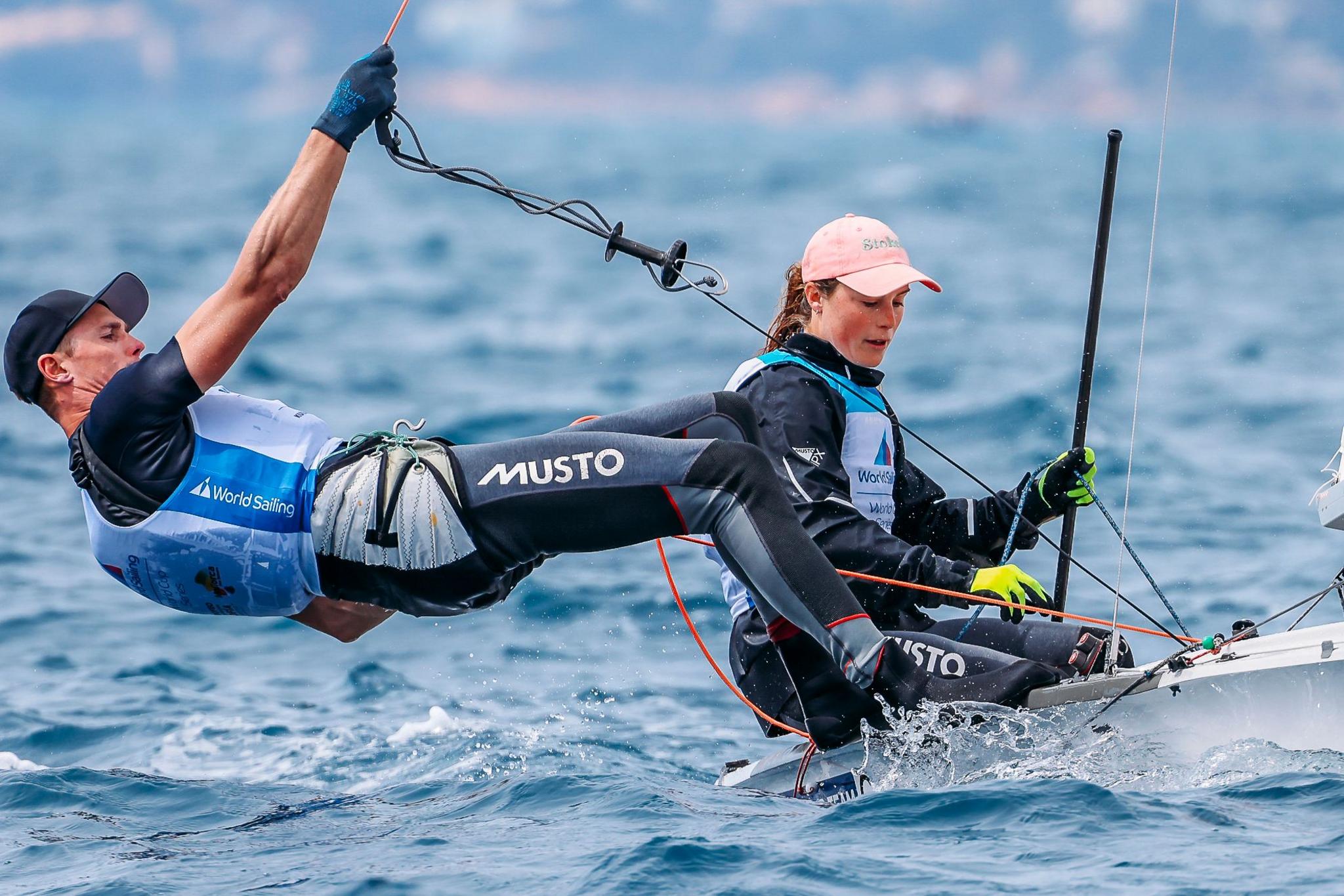 Chris Grube bending back as he sails a 470 dinghy with Vita Heathcote sailing 