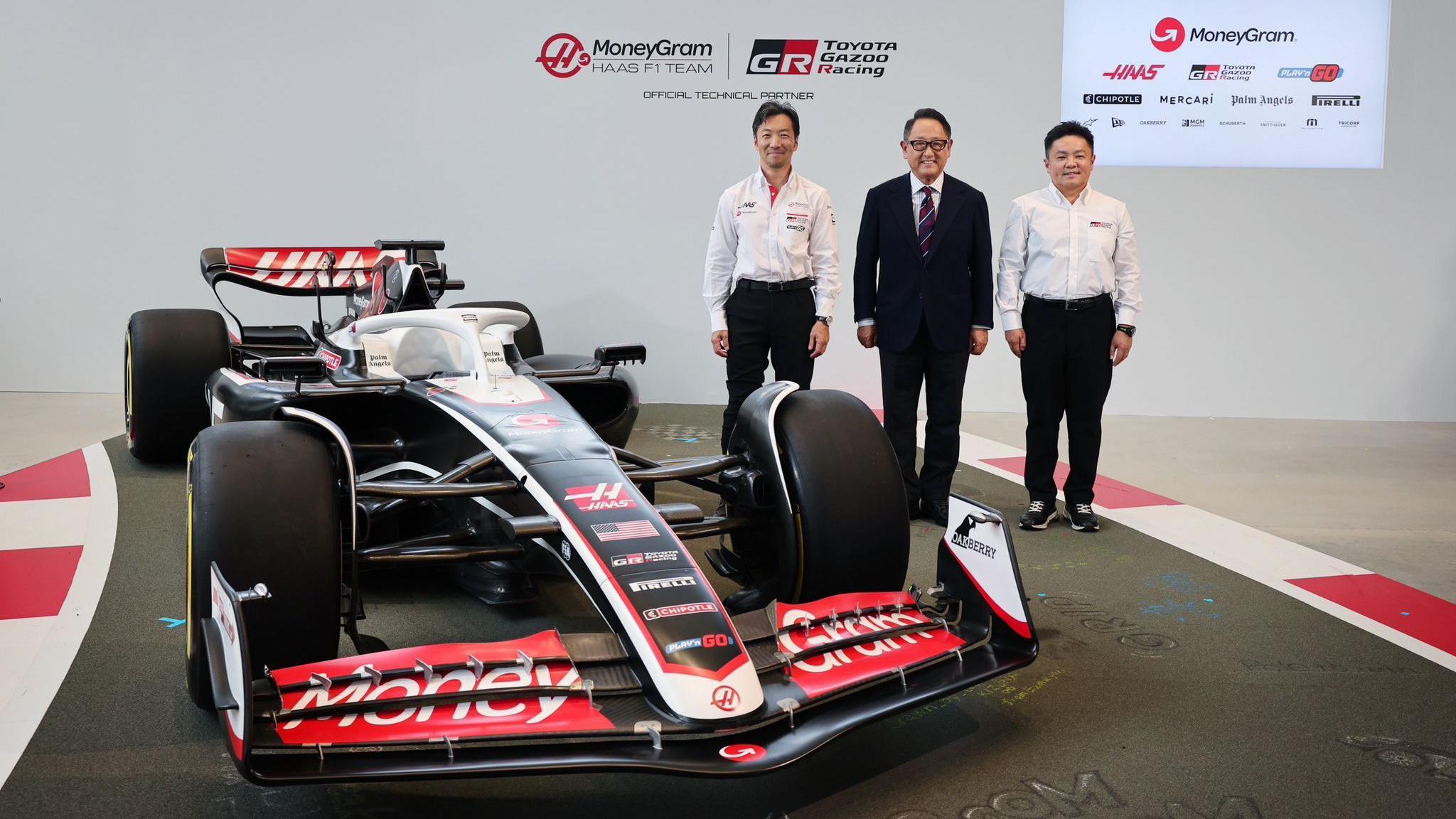 Haas team principal Ayao Komatsu with Akio Toyoda, chairman of Toyota Motor Corporation and Tomoya Takahashi, president of Toyota Gazoo Racing