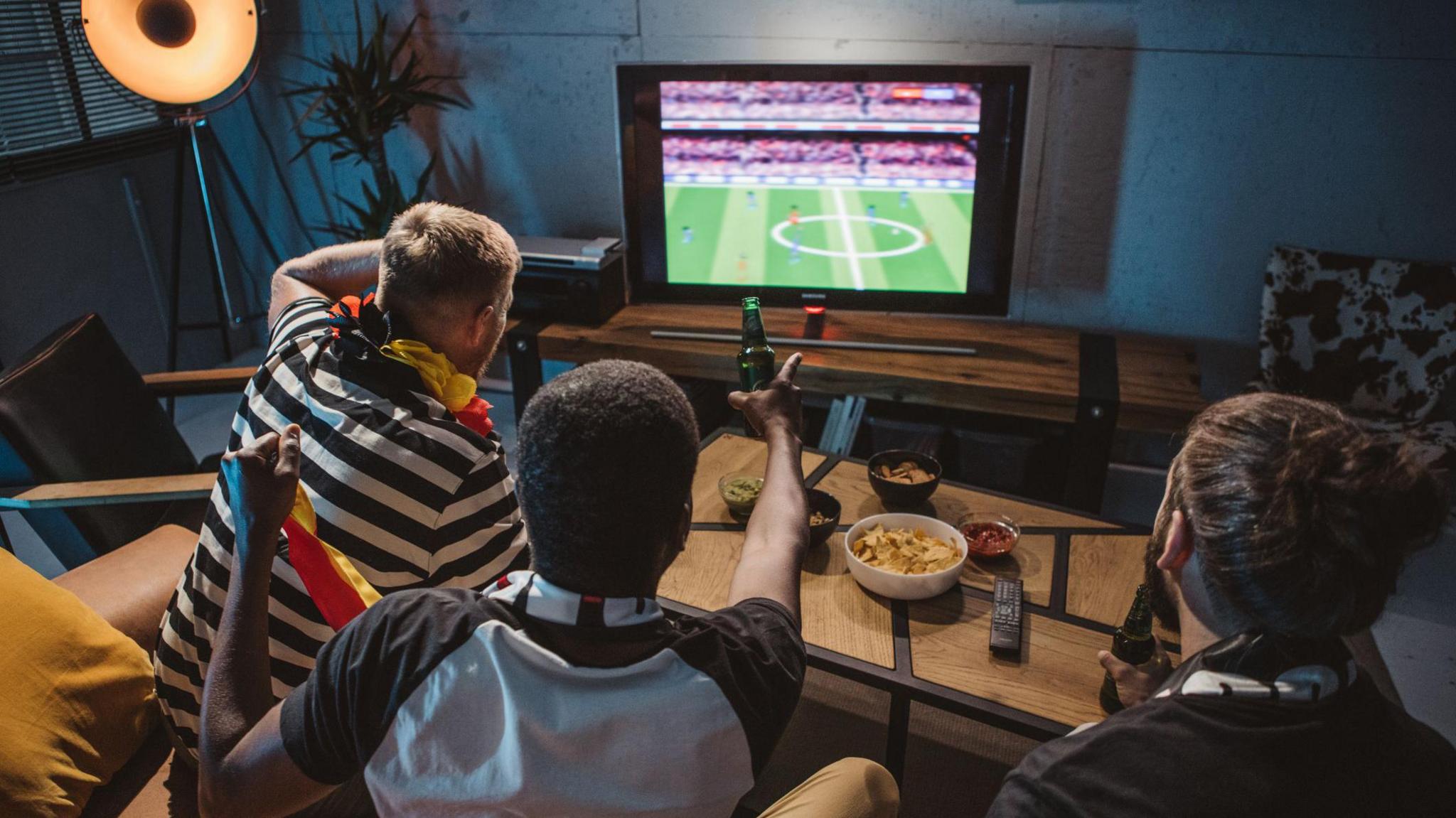 Children watch football on TV