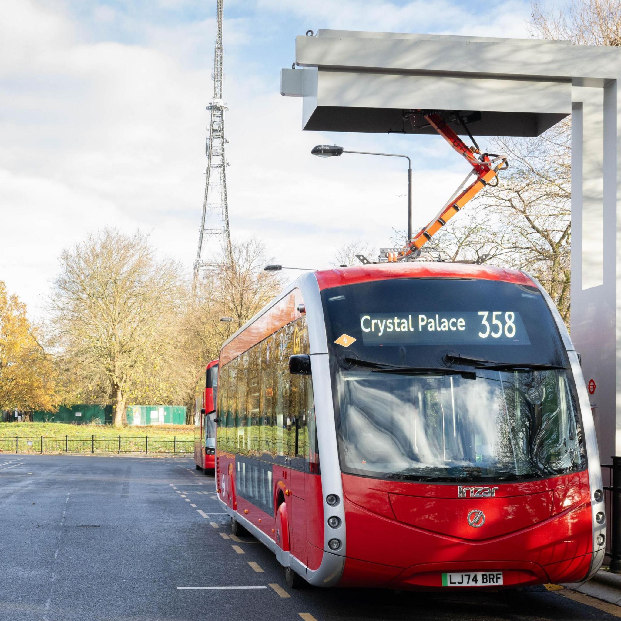 A 358 bus with an arm-like structure attached to the roof