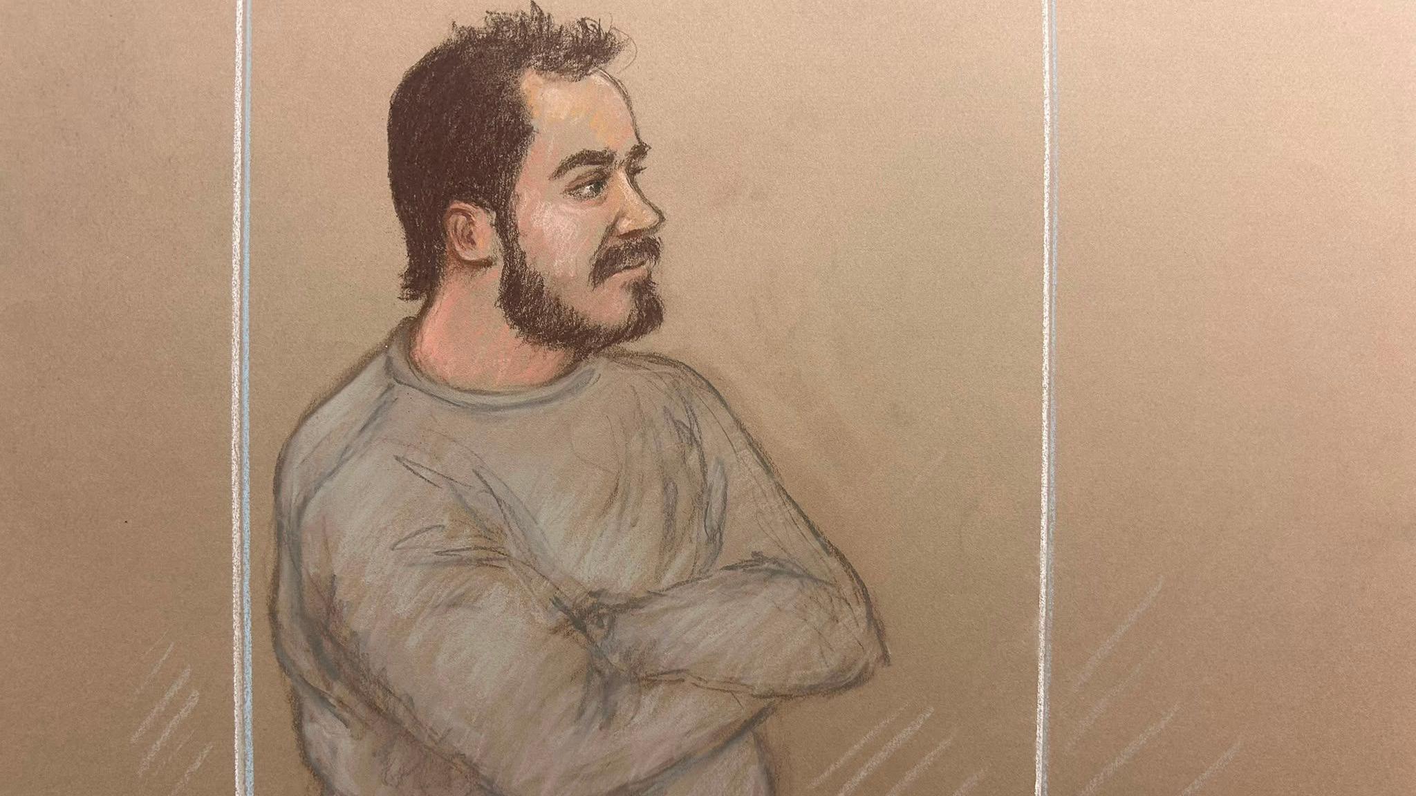 A man with short brown hair and a beard is pictured looking on in a dock while wearing a grey sweatshirt in a court sketch