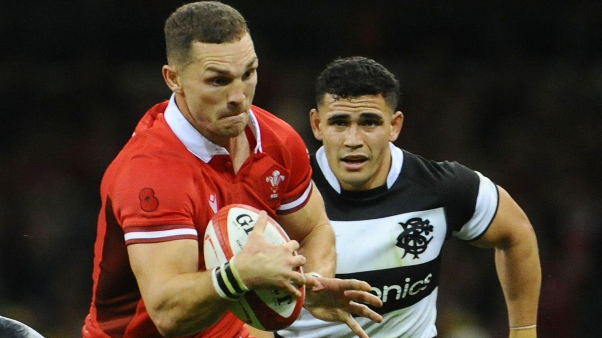 George North in the red jersey of Wales runs with the ball against the Barbarians