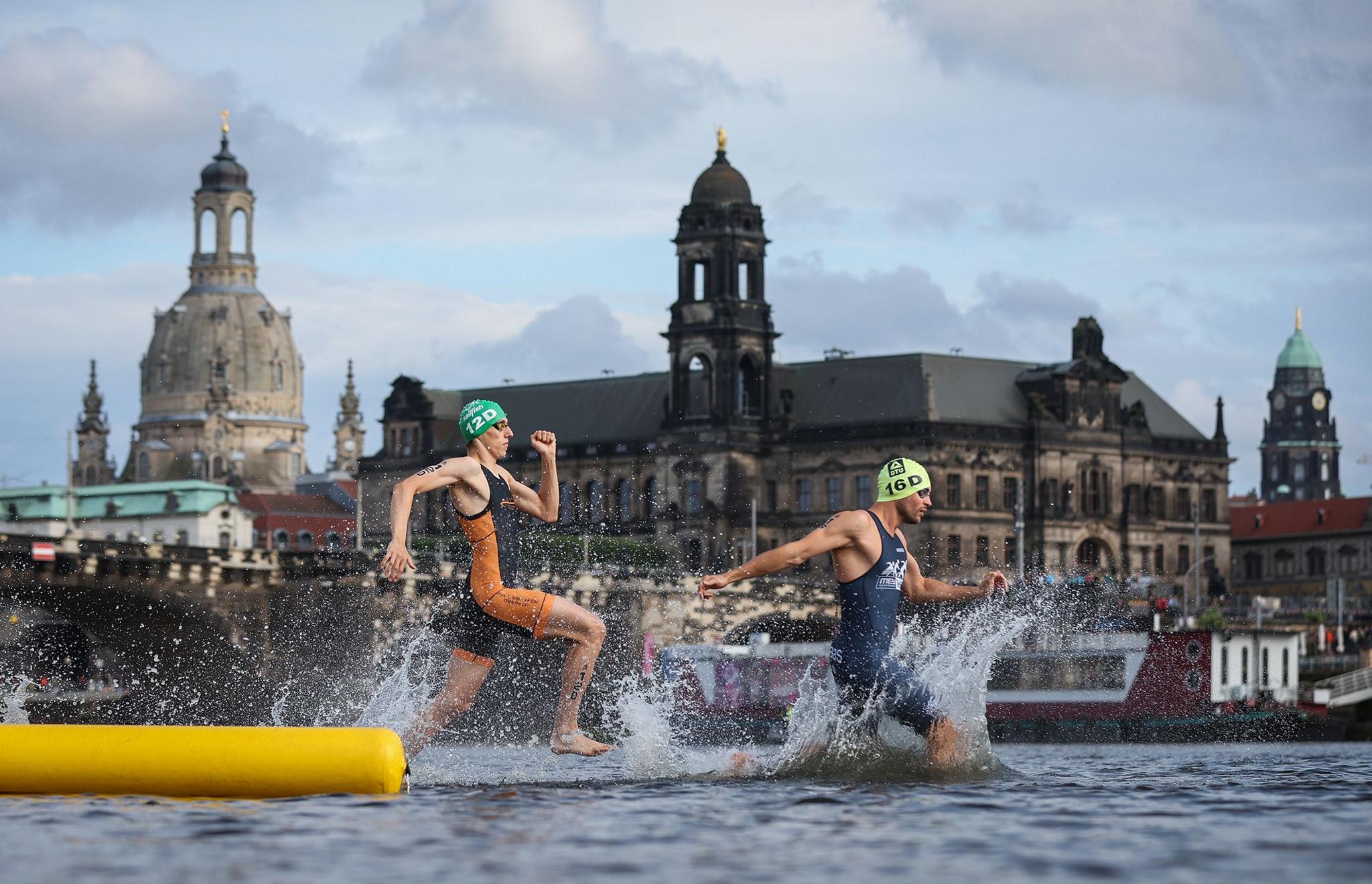 Athletes compete in the Triathlon Mixed Relay Elite in the river Elbe in front of the historic old town on day one of the multi sport event Die Finals in Dresden, Germany. Photo by Ronny Hartmann