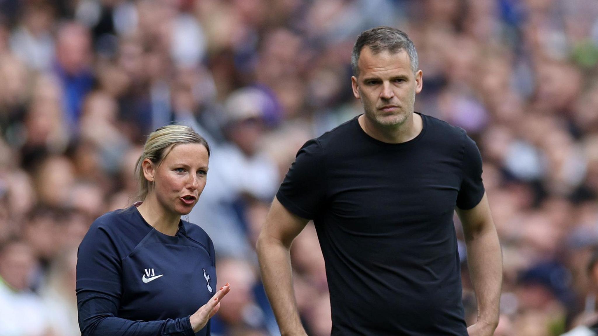 Vicky Jepson (left) and Robert Vilahamn (right) talking on the touchline