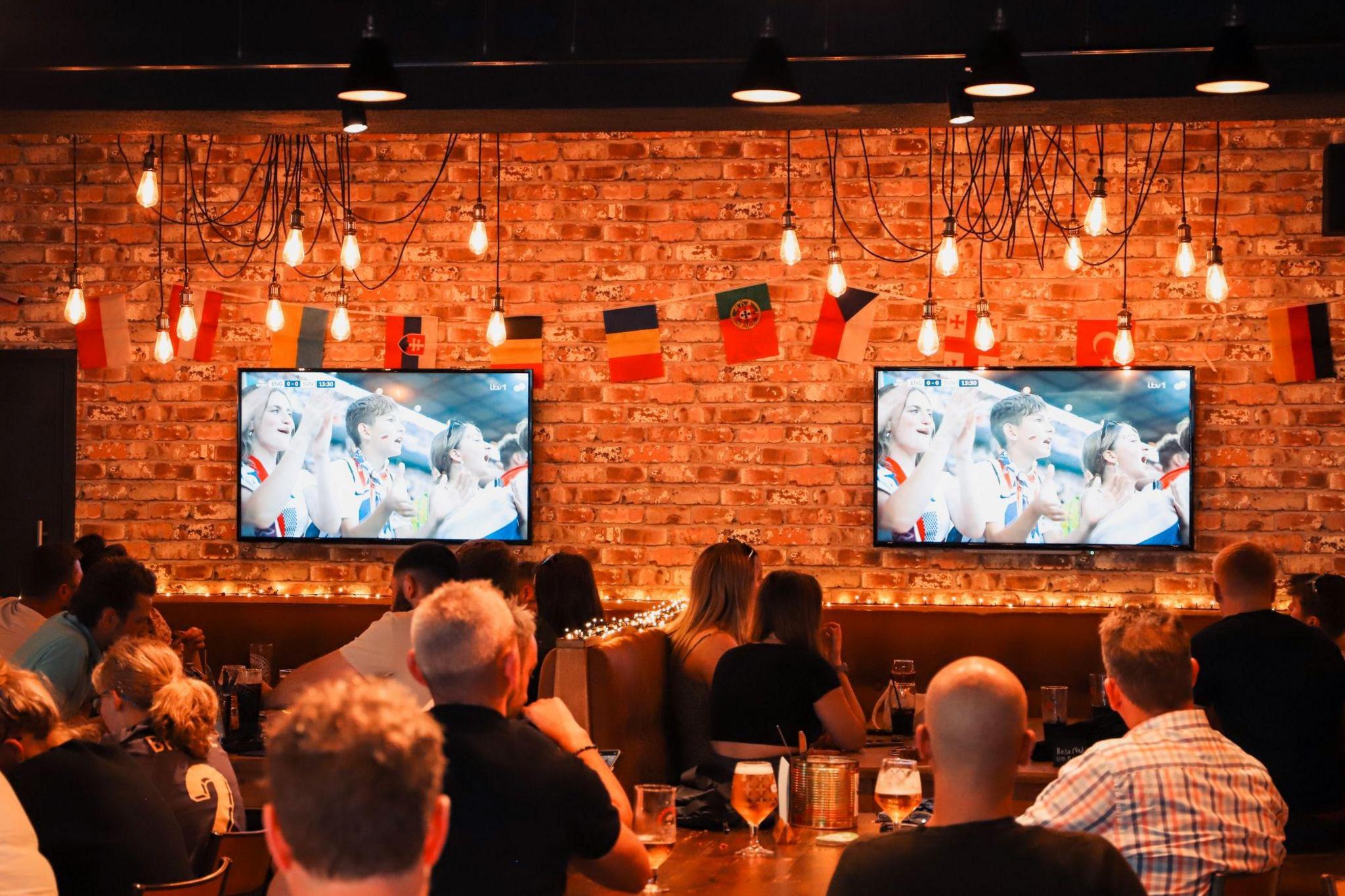 Fans watching football inside the Bull I' Th' Thorn