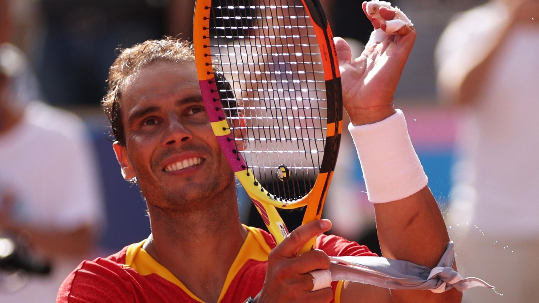 Rafael Nadal waves to the assemblage  astatine  Roland Garros during the Paris Olympics