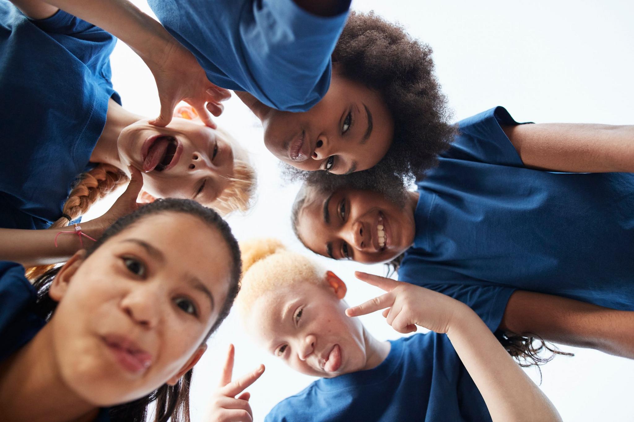 School children looking at the camera and smiling