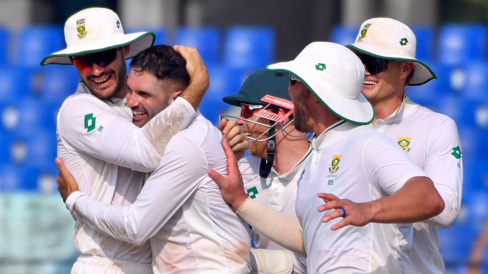 Keshav Maharaj and South Africa celebrate taking a wicket