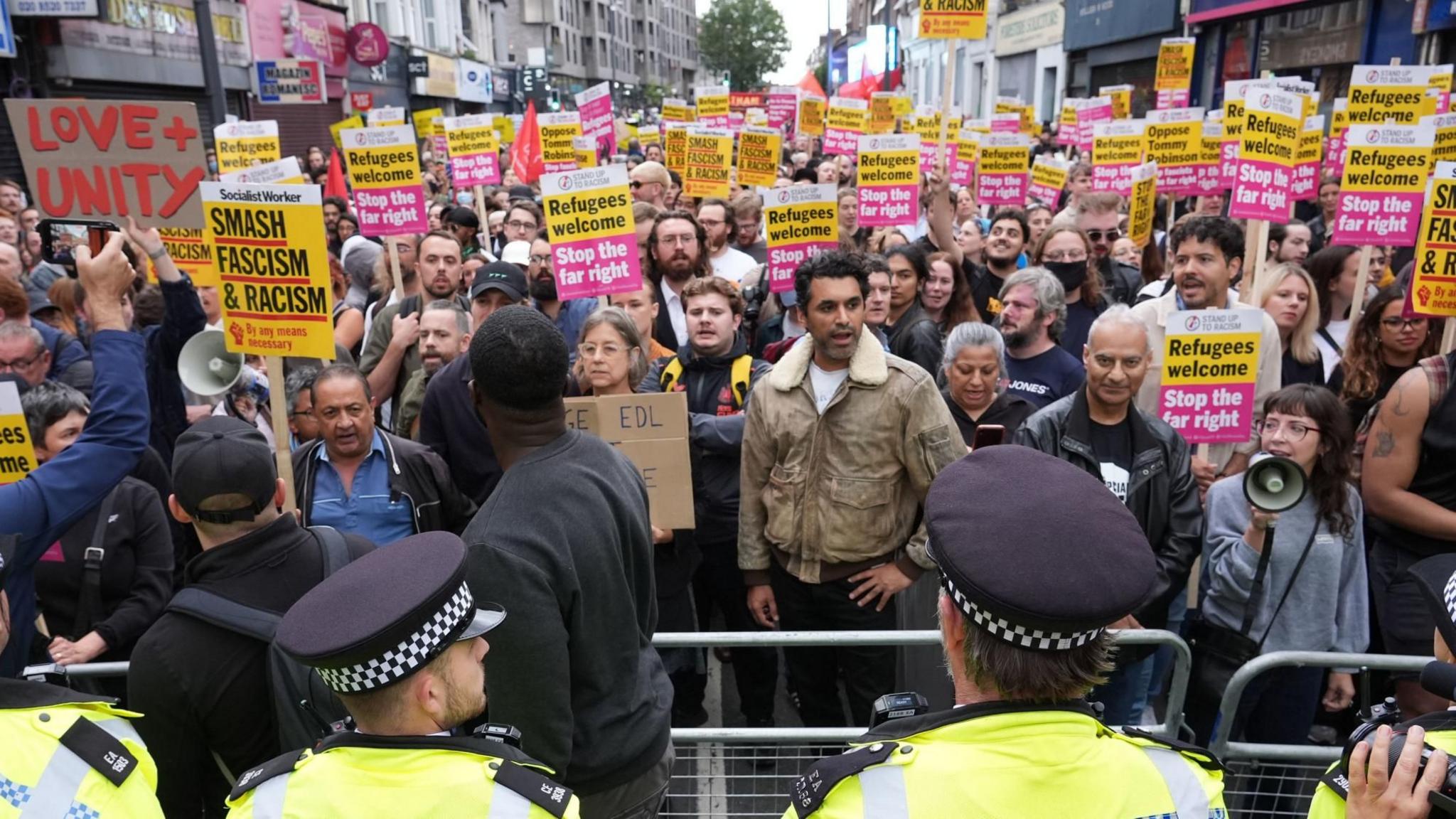 Demonstrators and police officers at an anti-racism protest in Walthamstow, London